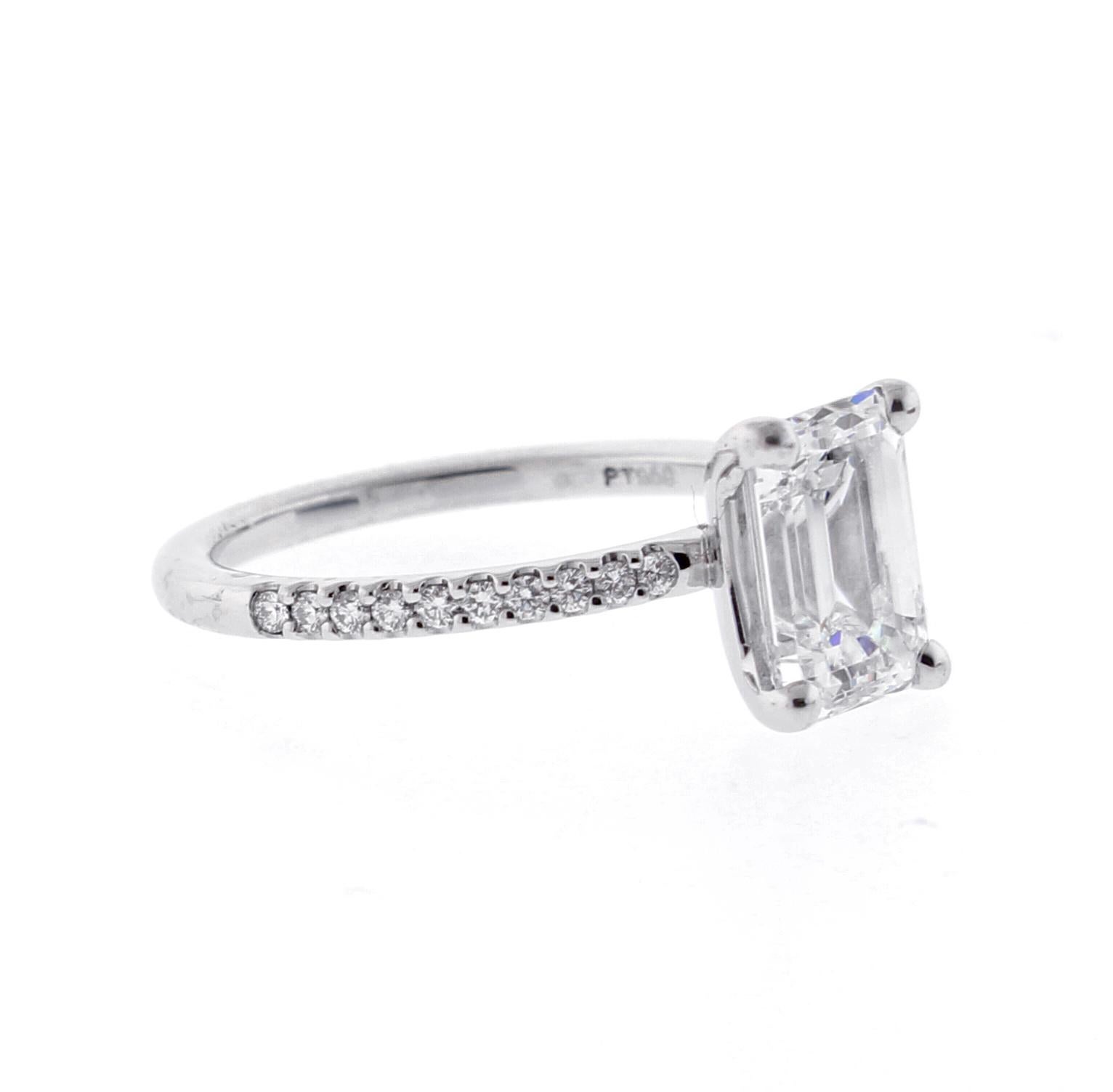 A perfectly proportioned Emerald Cut Diamond Solitaire sits on a band on diamonds
♦ Metal: Platinum
♦ Diamond=2.02 carats I color VS1 clarity
♦  20 Diamonds=.15
♦ Circa 2018
♦ Size 6, Resizable
♦ Packaging: Pampillonia presentation box 
♦ Condition: