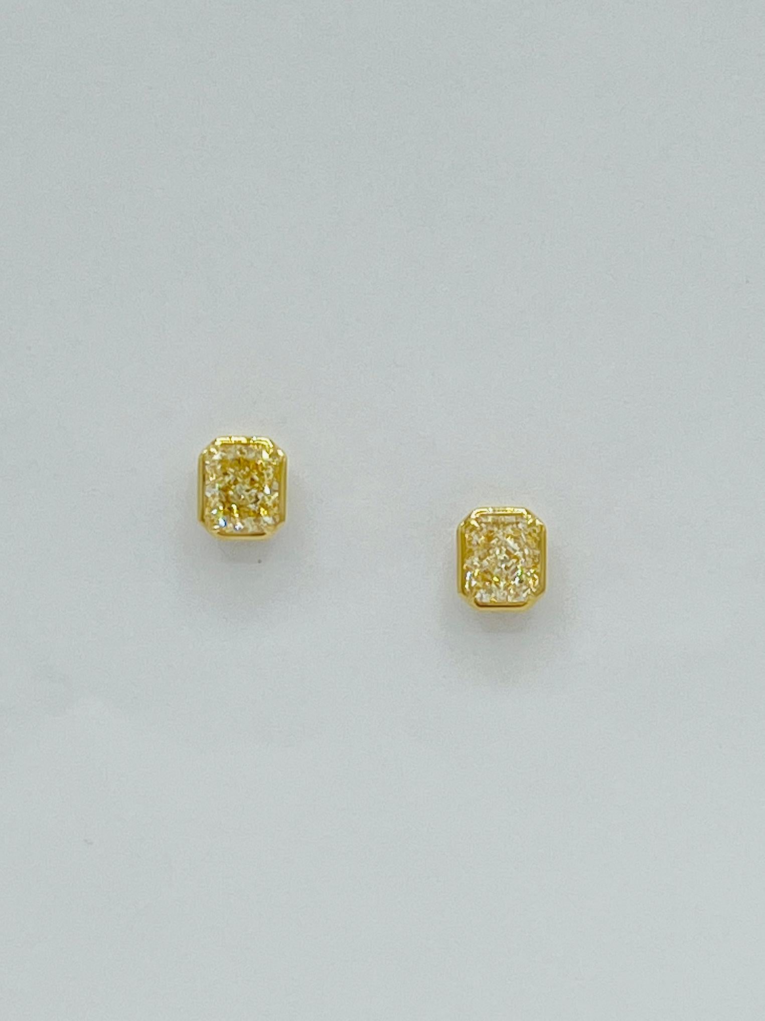 Women's or Men's GIA 2 Carats Each Radiant Yellow Diamond Bezel Stud Earrings in 18K Yellow Gold For Sale