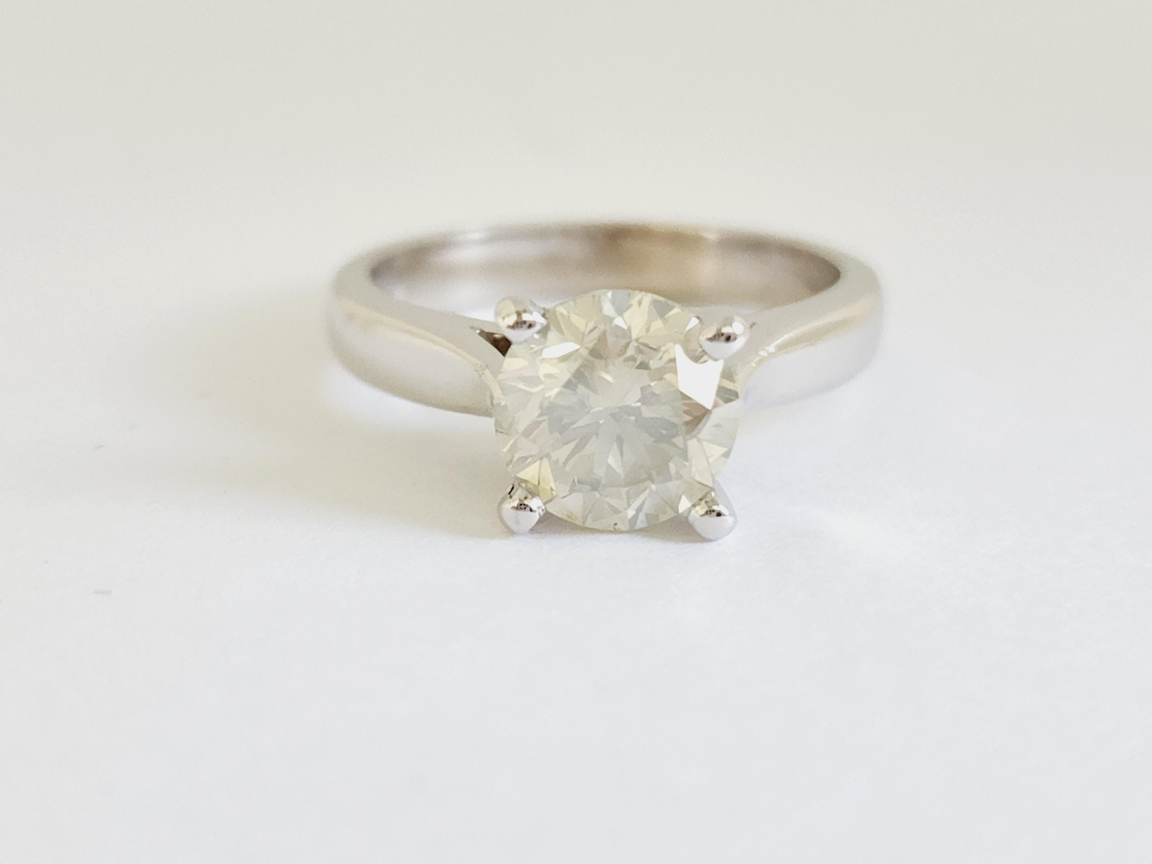 Natural GIA 2.01 Carat Fancy Light Grayish Greenish Yellow Round Diamond Ring 14 Karat White Gold. Set on 4-prong 14K white gold ring.
Ring size: 6.5