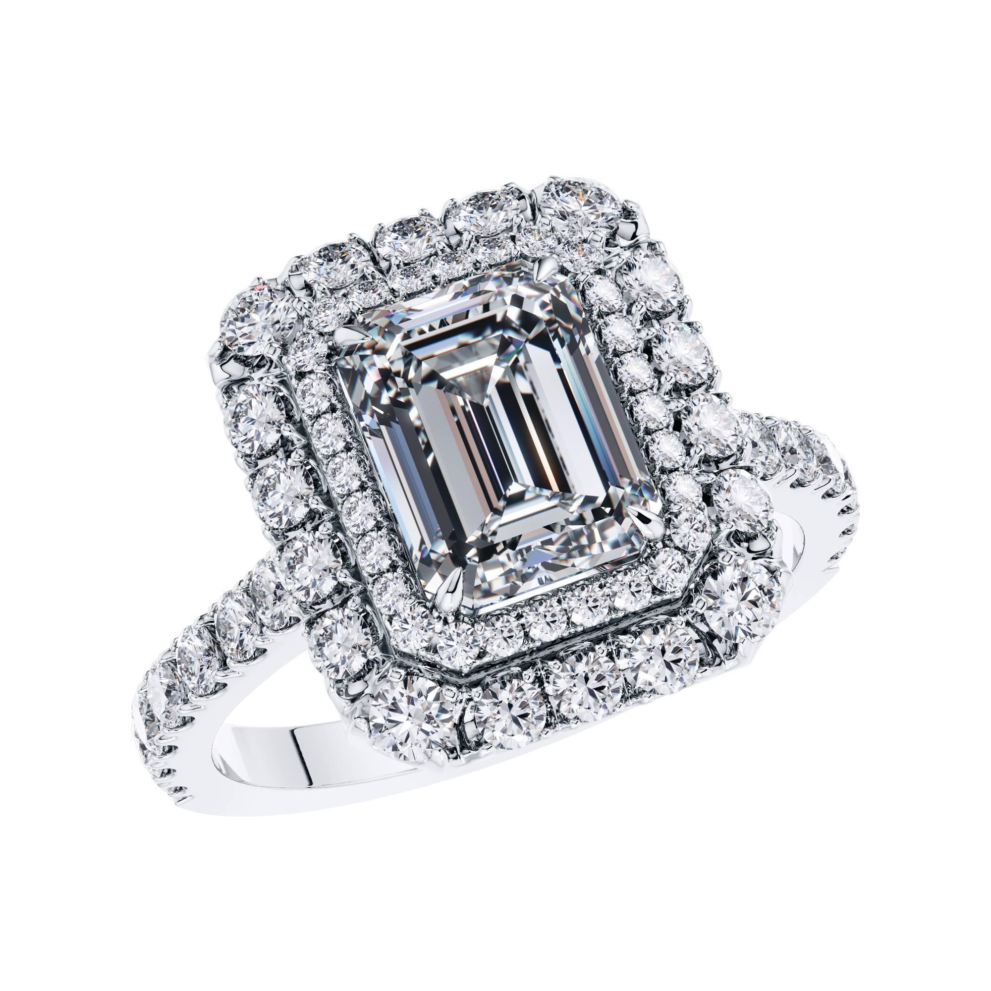 This Stunning GIA Certified 2.01 Carat white color E, clarity VS1 Emerald Cut Diamond which is set in the center of the Ring. It features 0.97 Carat  H SI1 Round Brilliant Diamonds around the sides and the Double Halo. An Engagement Ring with an