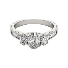 GIA Anello con diamante ovale a tre pietre inciso su canale in oro bianco 18 carati da 2,01 ct.
