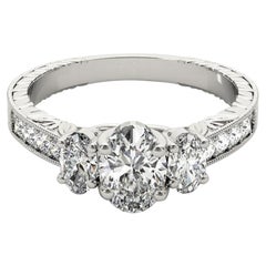 GIA 2,01ct ovale a tre pietre inciso su canale  Anello con diamante
