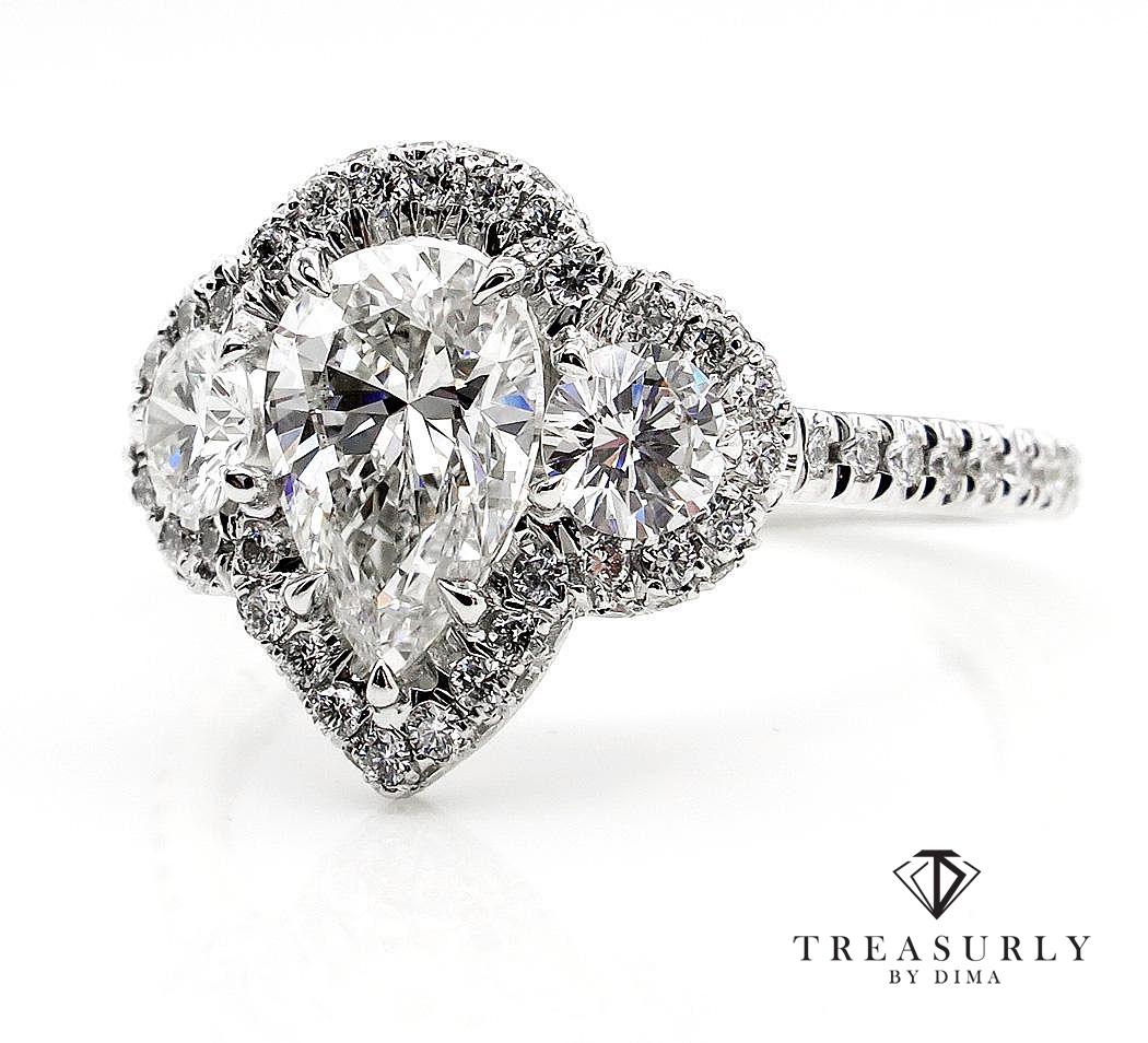 This is a BEAUTIFUL and very ELEGANT Three-Stone Engagement or Anniversary ring with PEAR Shaped Diamond ring!!
She will love this excellent engagement ring that has all the characteristics we look for in vintage jewelry.

The Center Diamond is a