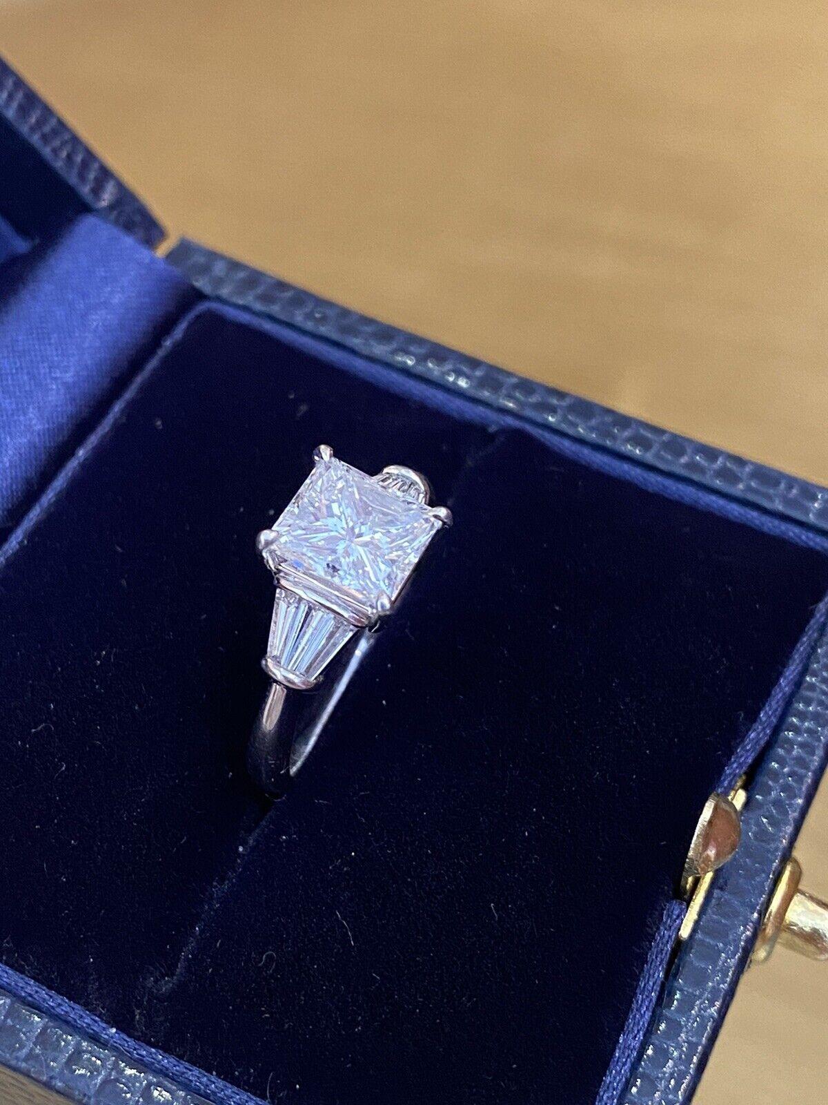 GIA 2.02 Carat E color Radiant Diamond with Baguettes Ring in Platinum In Excellent Condition For Sale In La Jolla, CA