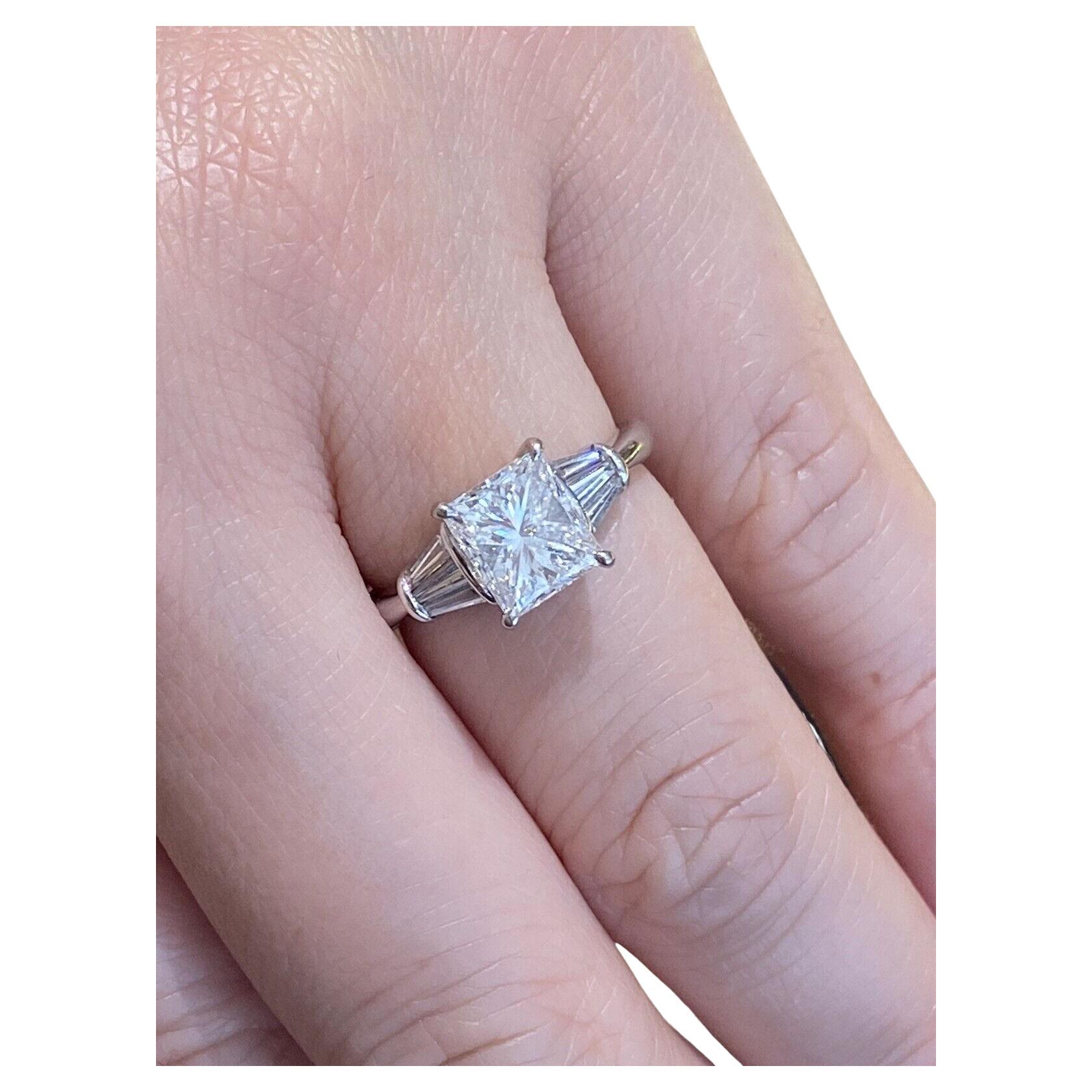 GIA 2.02 Carat E color Radiant Diamond with Baguettes Ring in Platinum For Sale