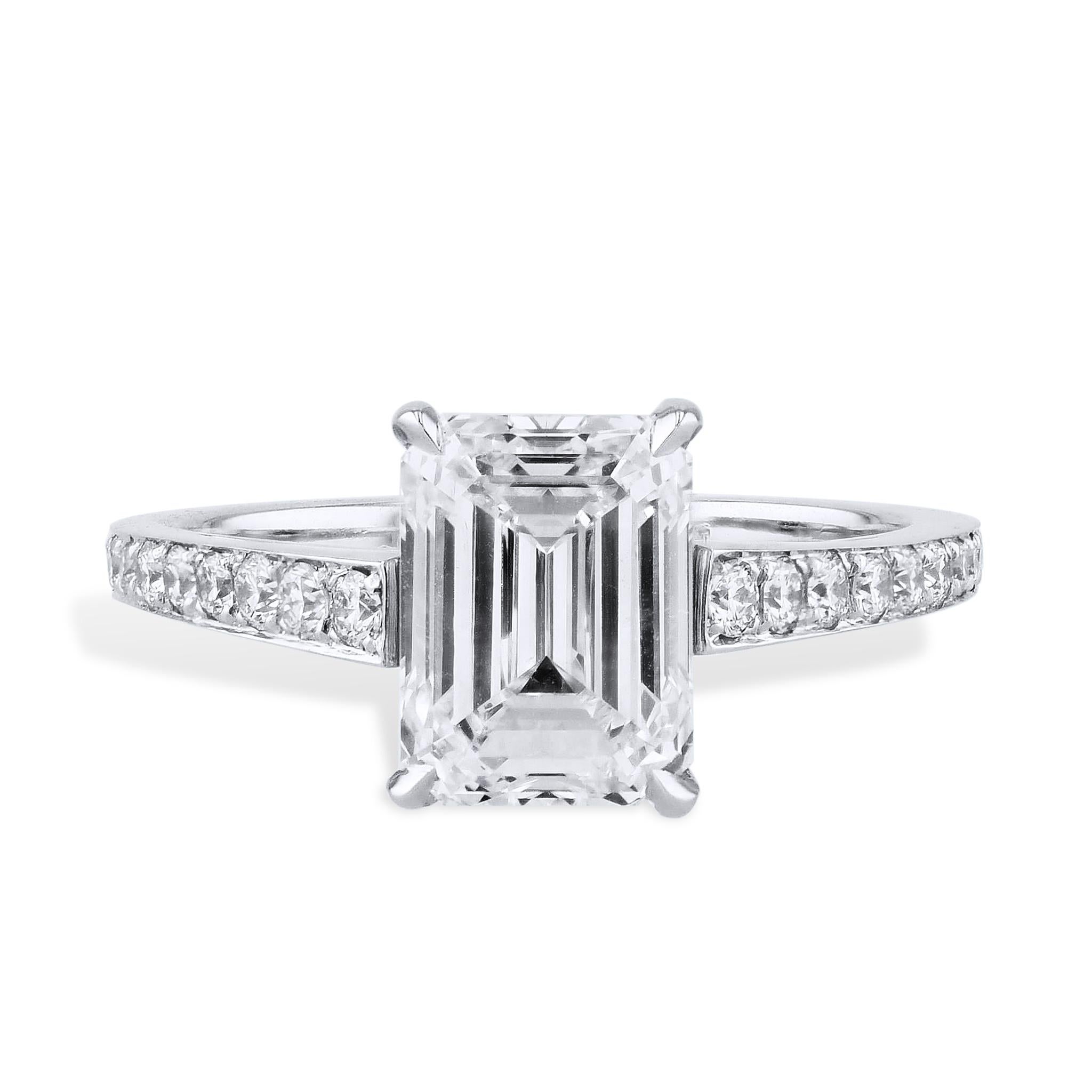 This mesmerizing emerald cut diamond platinum engagement ring features a stunning 2.02 carat center stone that is surrounded by and additional 18 dazzling diamonds that total 0.20 carats.

This is a handmade ring and is currently a size 4.25. It can