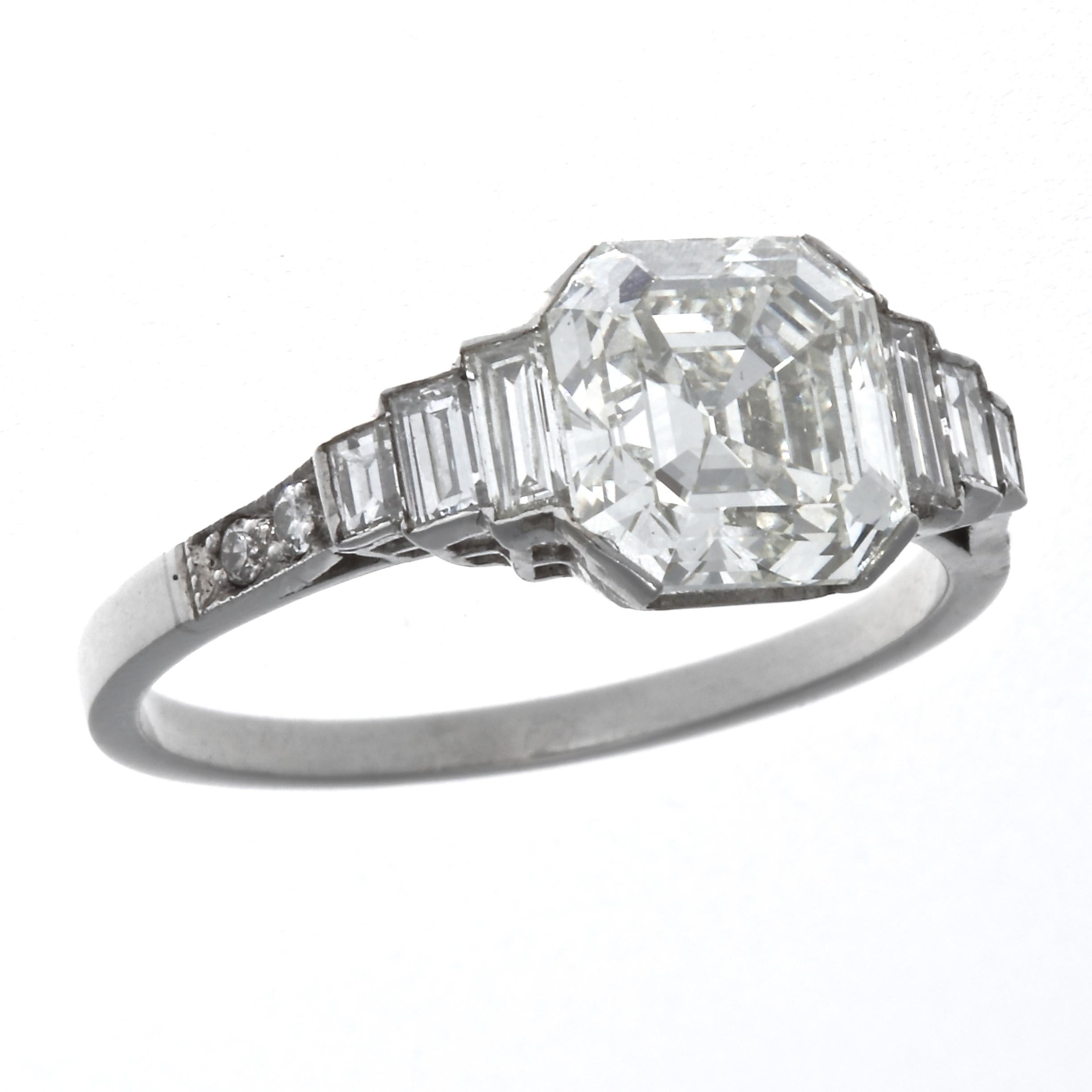 A Jack Weir & Sons creation featuring a well proportioned square emerald cut diamond that is lively and bright. Nestled in a diamond platinum ring that brings out all the fine qualities of the diamond. GIA graded as 2.03 carats, K color, VS2