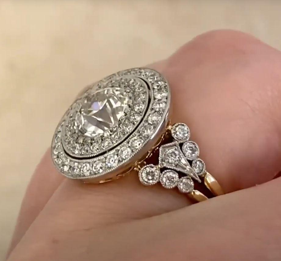 This exquisite halo ring showcases a stunning GIA-certified approx. 2.00-carat old European cut diamond, graded K color and SI2 clarity. The center stone is elegantly framed by a dazzling double halo of pavé-set old European cut diamonds, enhancing