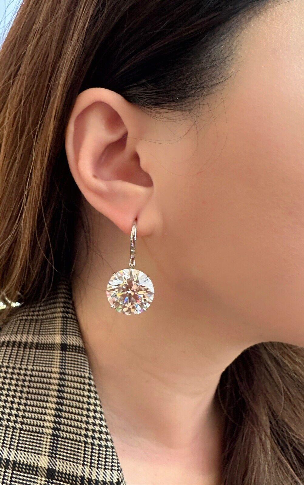 GIA Certified 
20.63 & 21.17 carat Round Brilliant Diamond 
Drop Earrings in 18k White Gold

Features
21.17 carat; L color & VS1 clarity
20.63 carat; O-P Range color & SI1 clarity

GIA Certified
with laser inscribed GIA number on each stone
( See