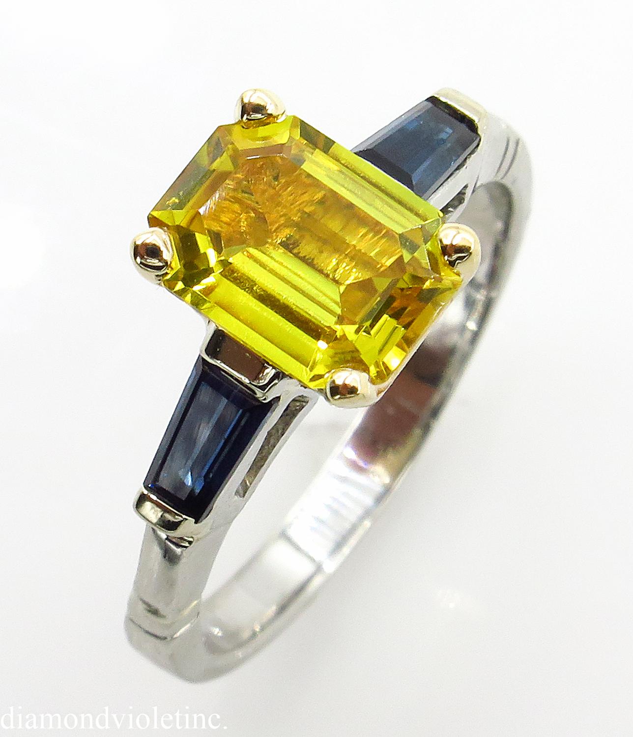 A Breathtaking Estate Vintage HANDMADE Platinum (tested) Engagement ring dazzles GIA certified NATURAL Emerald cut Yellow Sapphire; with measurements of 8.04x5.99mm; estimated weight is 1.57ct. GIA report # 5191337924. The center stone is set into
