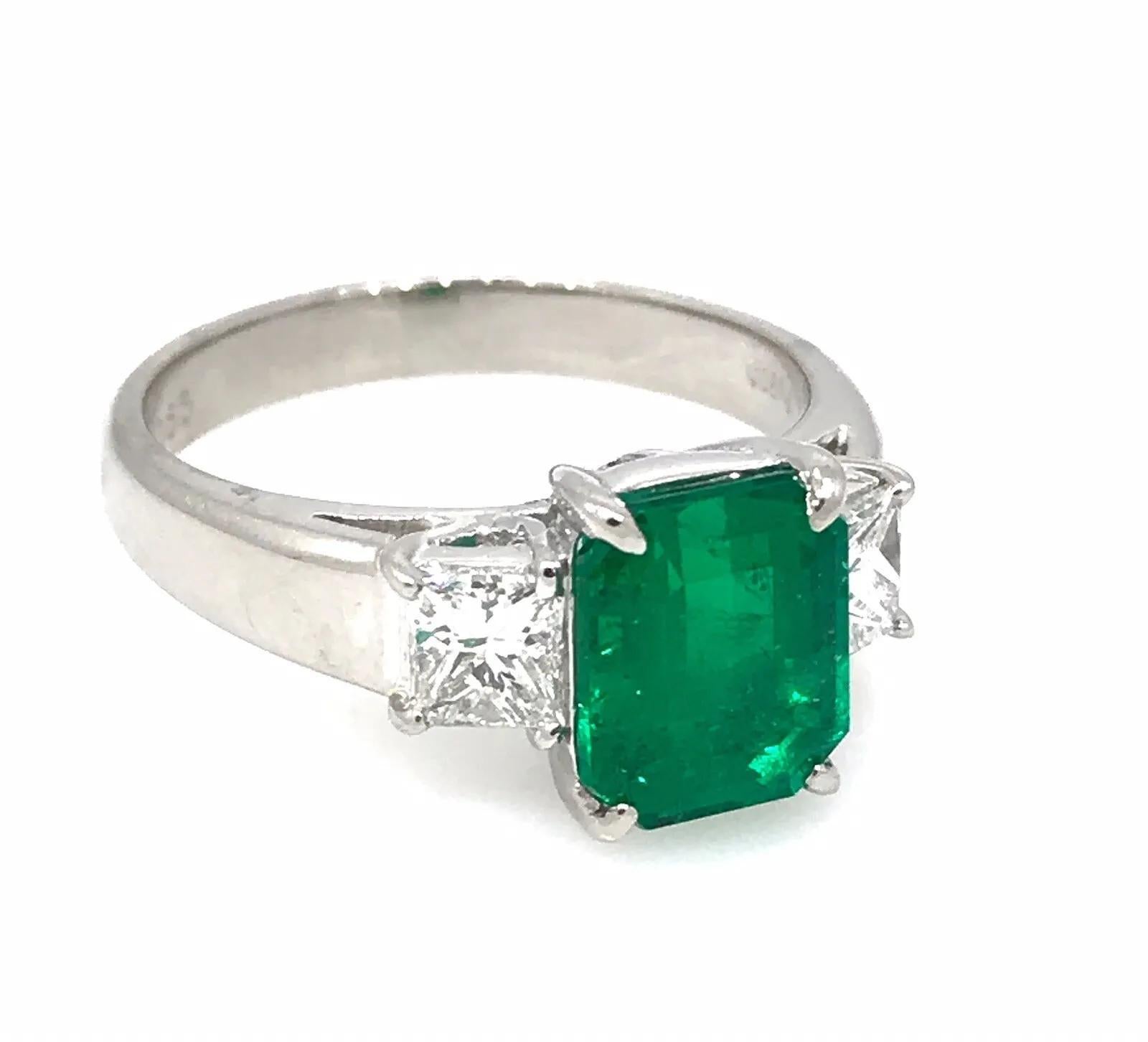 GIA Certified 2.09 carat Emerald Ring with Side Diamonds in Platinum

Emerald and Diamond Ring features a bright lively Green Rectangular-cut Emerald in the center with 2 Princess-cut Diamonds set in Platinum.

The emerald is of Colombian origin and