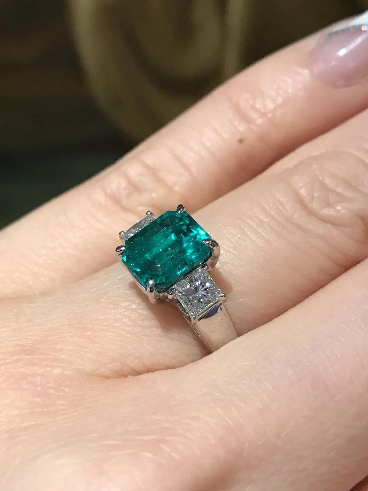 Octagon Cut GIA 2.09 carat Colombian Emerald Three-stone Ring with Diamonds in Platinum For Sale