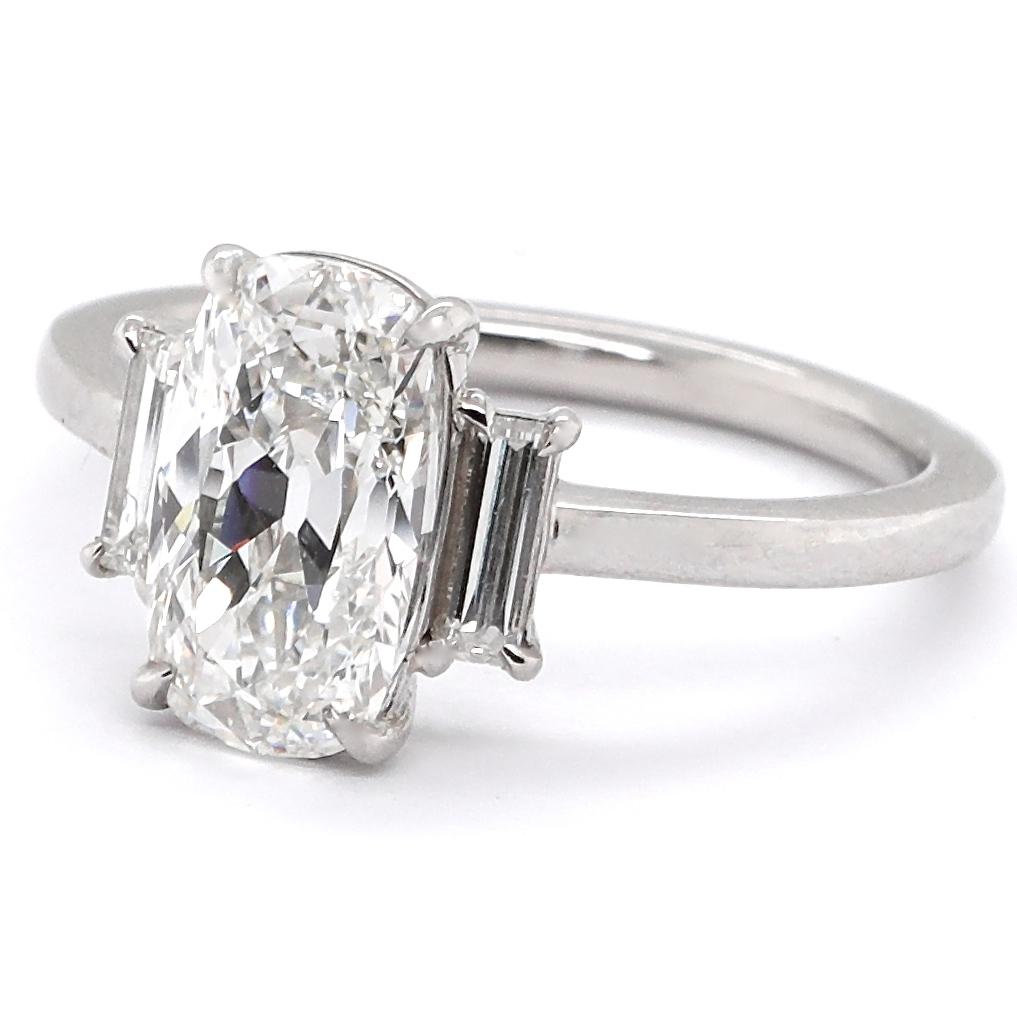Are you looking for something classic but different? Consider this striking beauty. The center stone is an elongated Old Mine Cut, which gives this ring a unique look. It's a modern made platinum ring that features an antique GIA certified 2.09