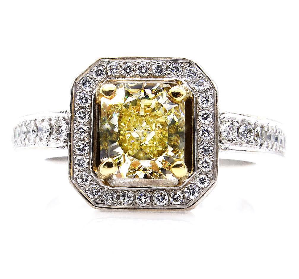 This Sparkling Estate Diamond Ring with almost 2ct in diamonds (1.85ctw).will take your breath away!!
Center Diamond is Radiant 1.23CT GIA Certified as Fancy Brownish YELLOW color, SI1 clarity. Clear, bright and Brilliant, Nice Saturated Even