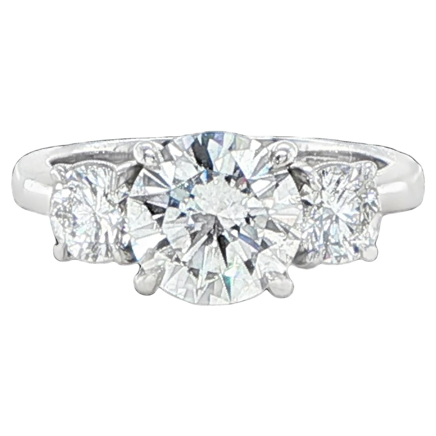 GIA 2.10 Carat Round Diamond Platinum Three Stone Engagement Ring For Sale