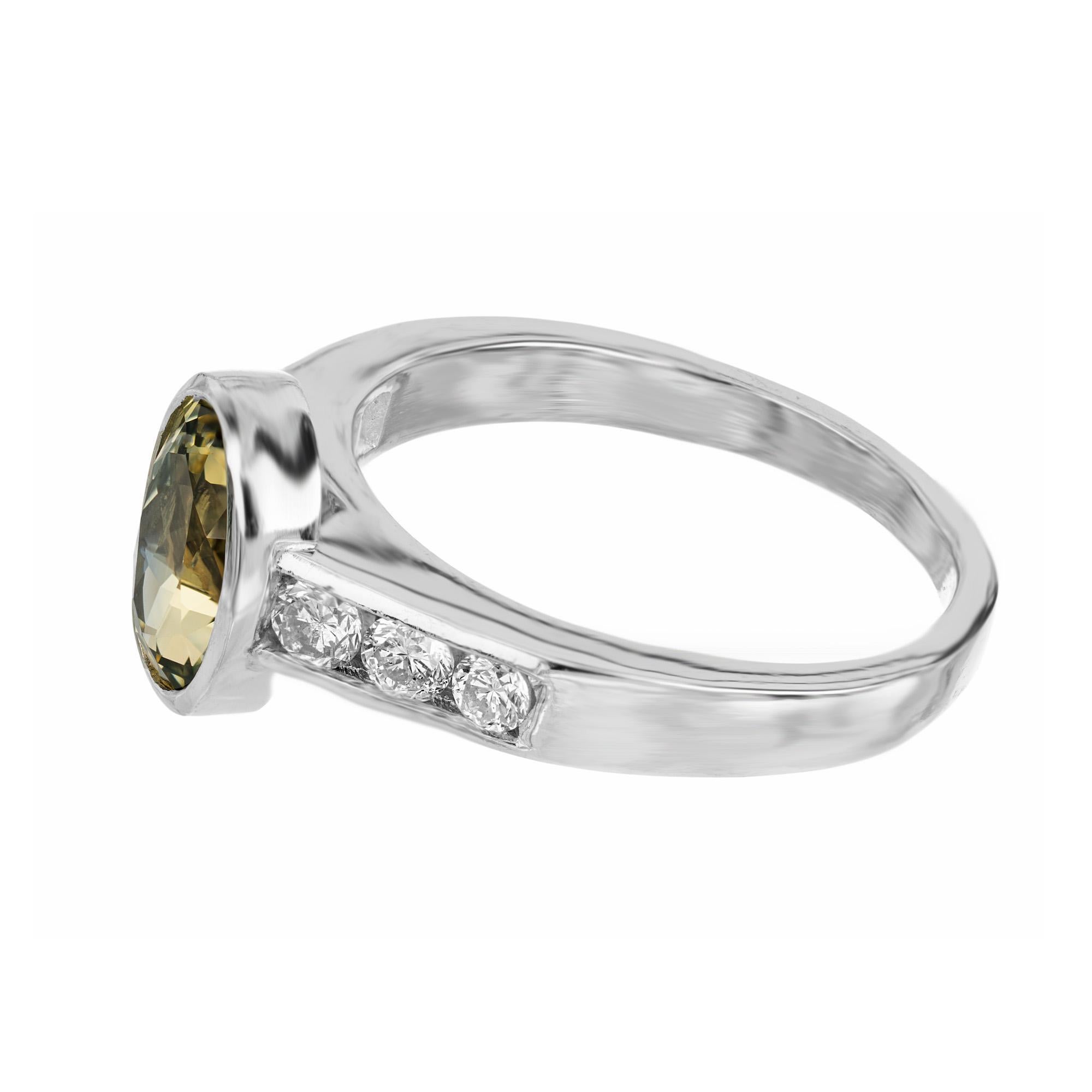 oval green sapphire and diamond engagement ring