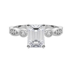 GIA 2,20ct Smeraldo Marquise e anello rotondo con castone di diamanti a grana grossa