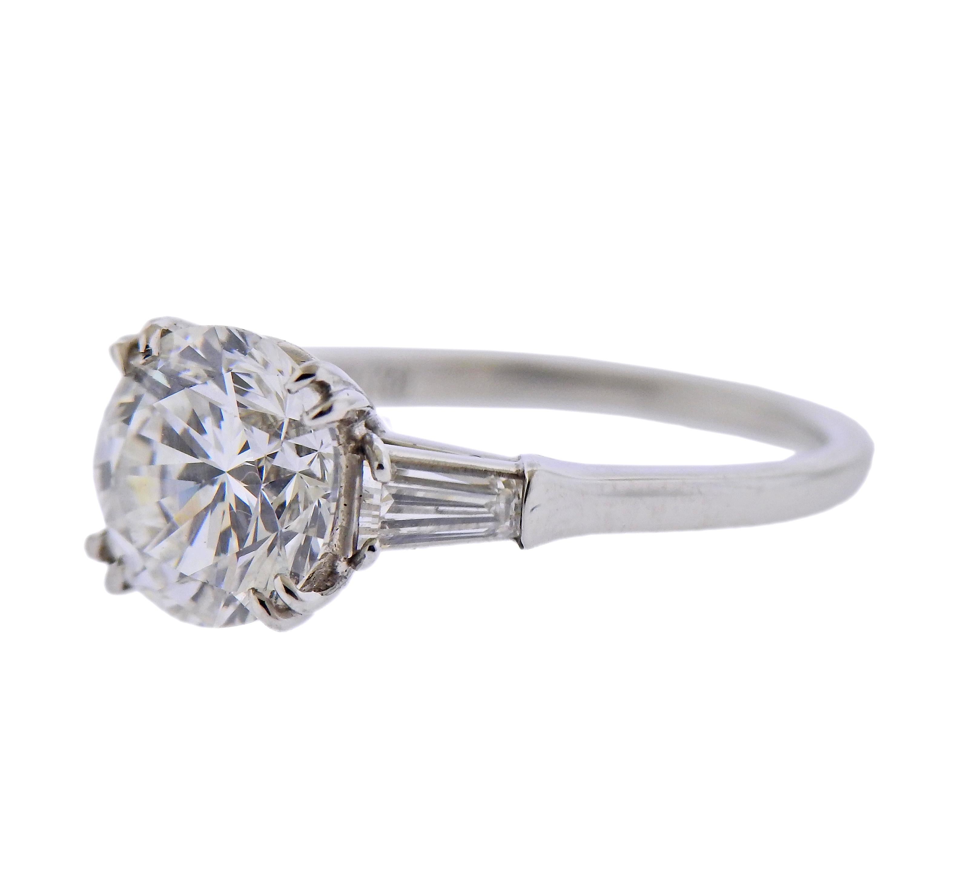 GIA certified 2.23ct F/VS1 diamond, set in Harry Winston platinum ring, with two side tapered baguettes. Ring size - 5.25. Marked: Platinum, 2.23, Winston. Weight - 4.5 grams. 