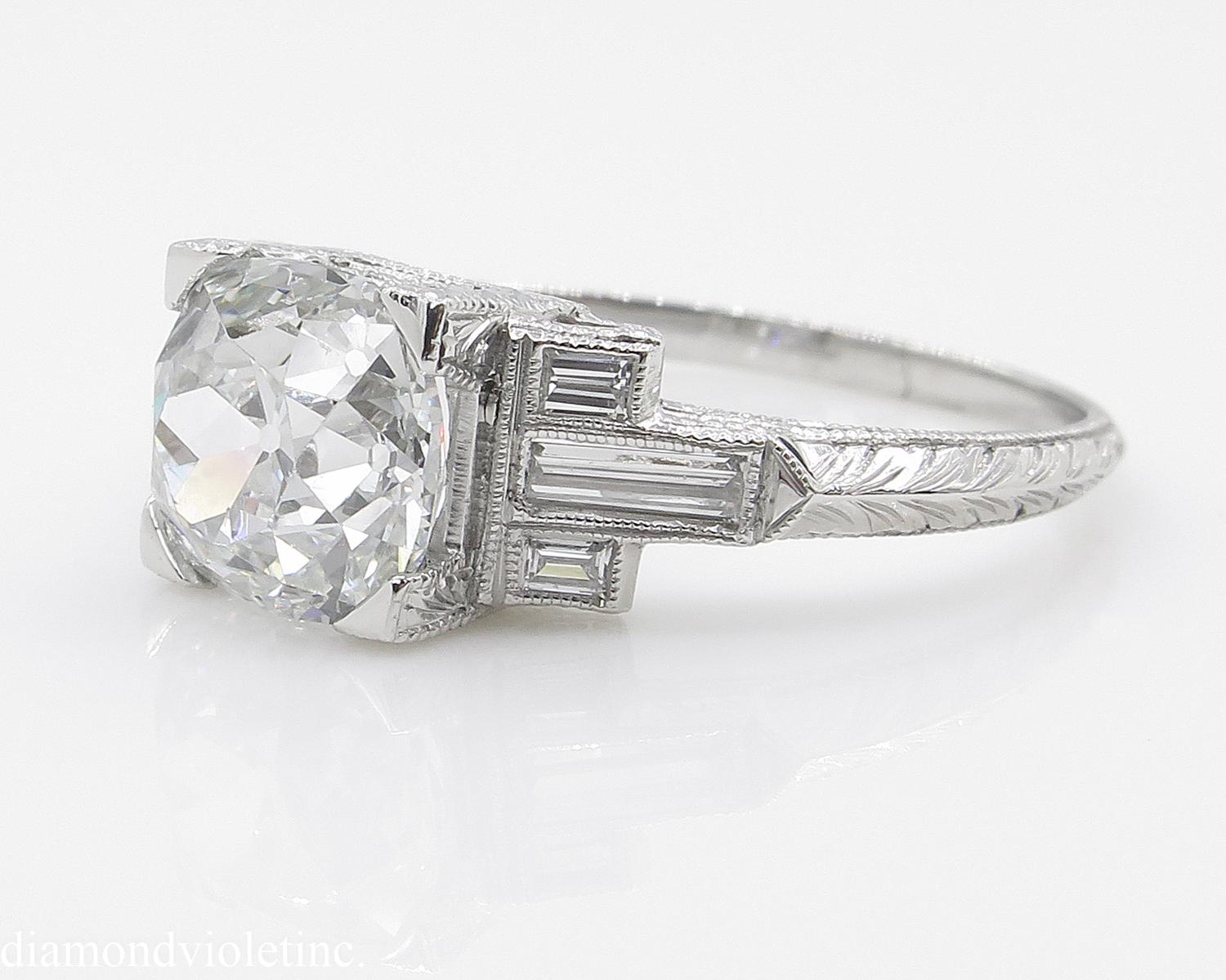 An Amazing Vintage Art Deco Handmade Platinum (stamped) Engagement ring dazzles with GIA Certified Sy 2 carats (1.95ct) Old Mine Cushion Center Diamond J color, SI1 clarity (Near COLORLESS and eye CLEAR), very Bright and Brilliant.
A one of a kind