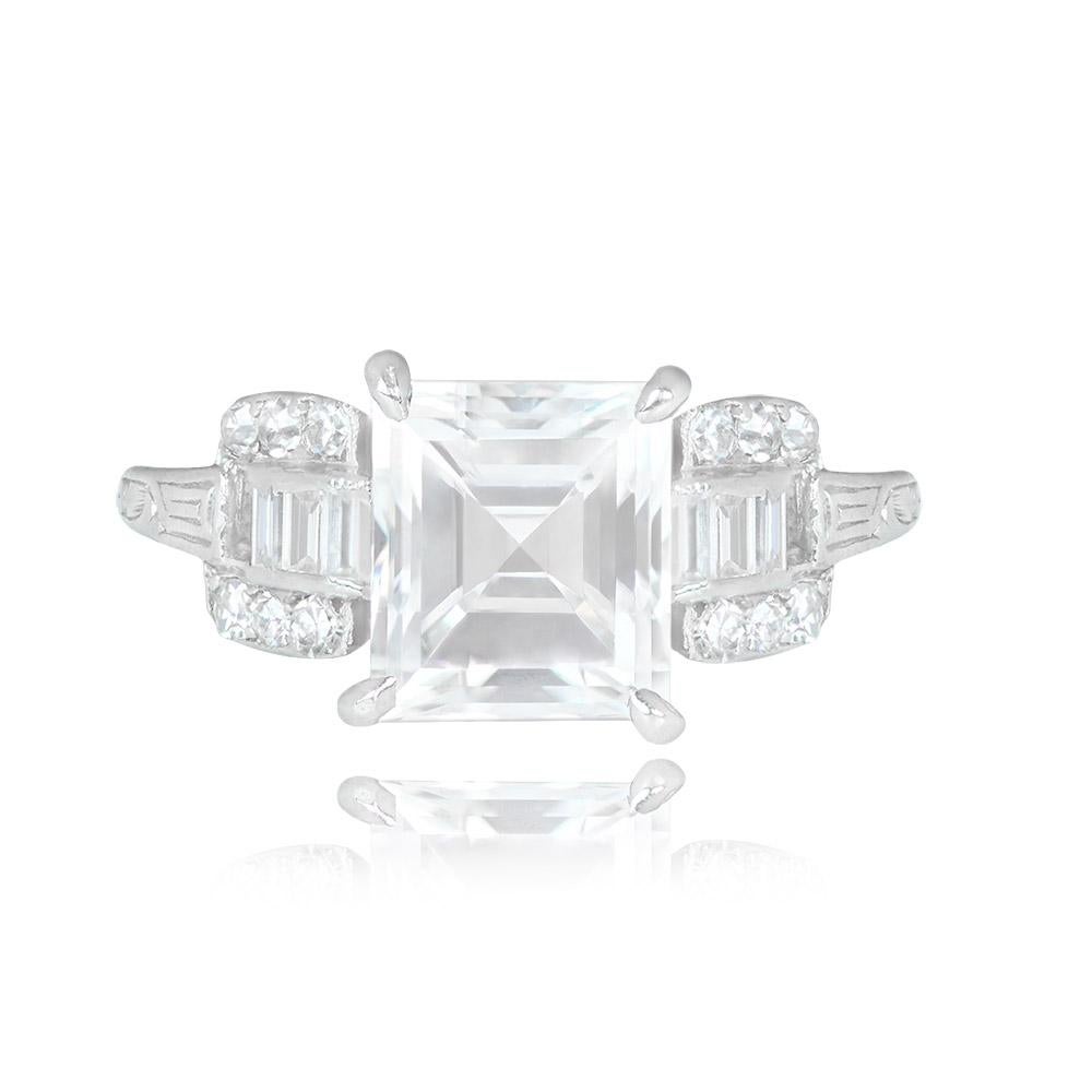 A platinum ring showcases a GIA-certified 2.24-carat carre cut diamond with a remarkable D color and IF clarity. The central diamond is elegantly secured in prongs and accompanied by baguette-cut diamonds. Rows of single-cut diamonds adorn the
