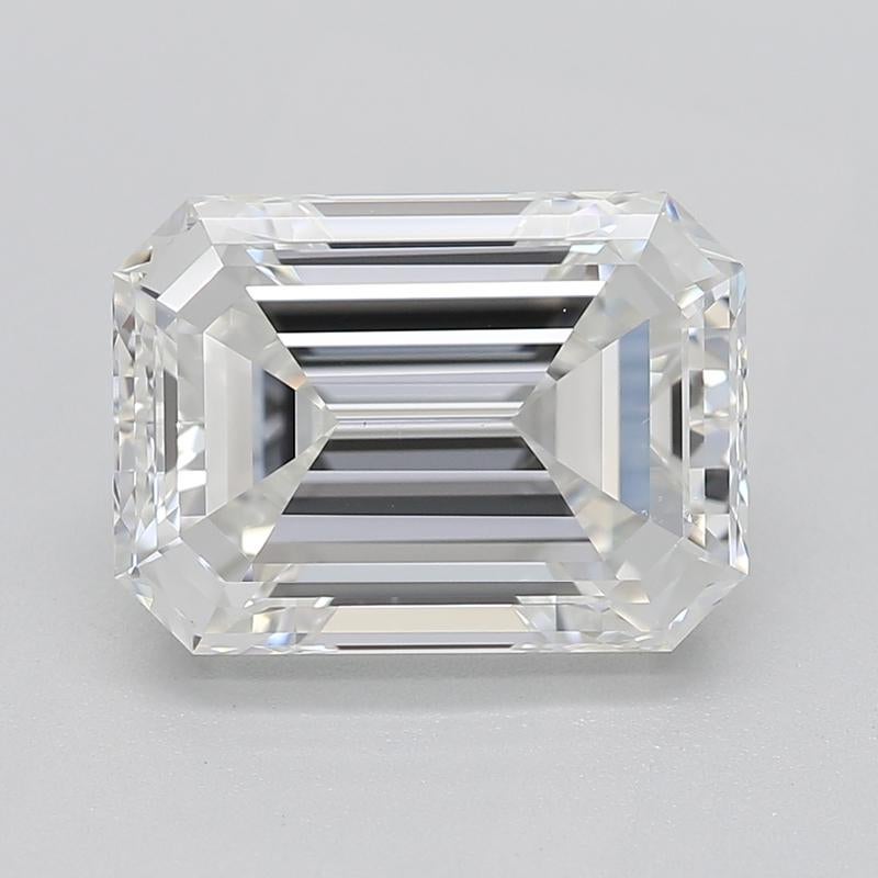 Elegantly designed, this stunning diamond ring captivates with its remarkable features. At the heart of this piece lies a breathtaking emerald G VS1 2.30 diamond, securely held in a raised prong setting that enhances its brilliance and fire. The