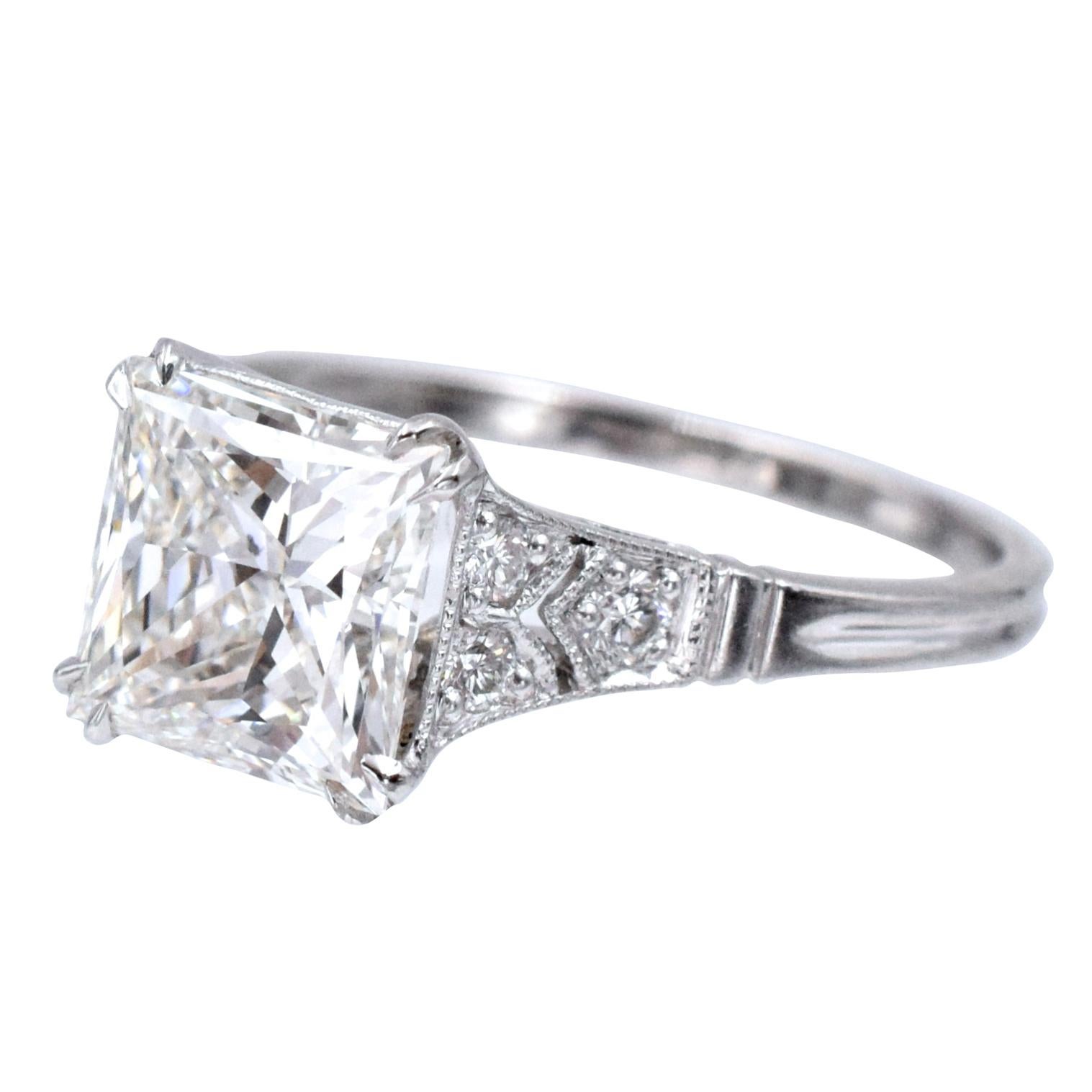 Engagement ring. Made in platinum Art- Deco inspired mounting set with 6 round cut diamonds, total weight 0.12 carat ,color: G-H, clarity: VS. In the center: 2.33 carat  princess cut diamond, 
color: I, clarity: : VS1, GIA# 16420936. Ring size: 6.5. 