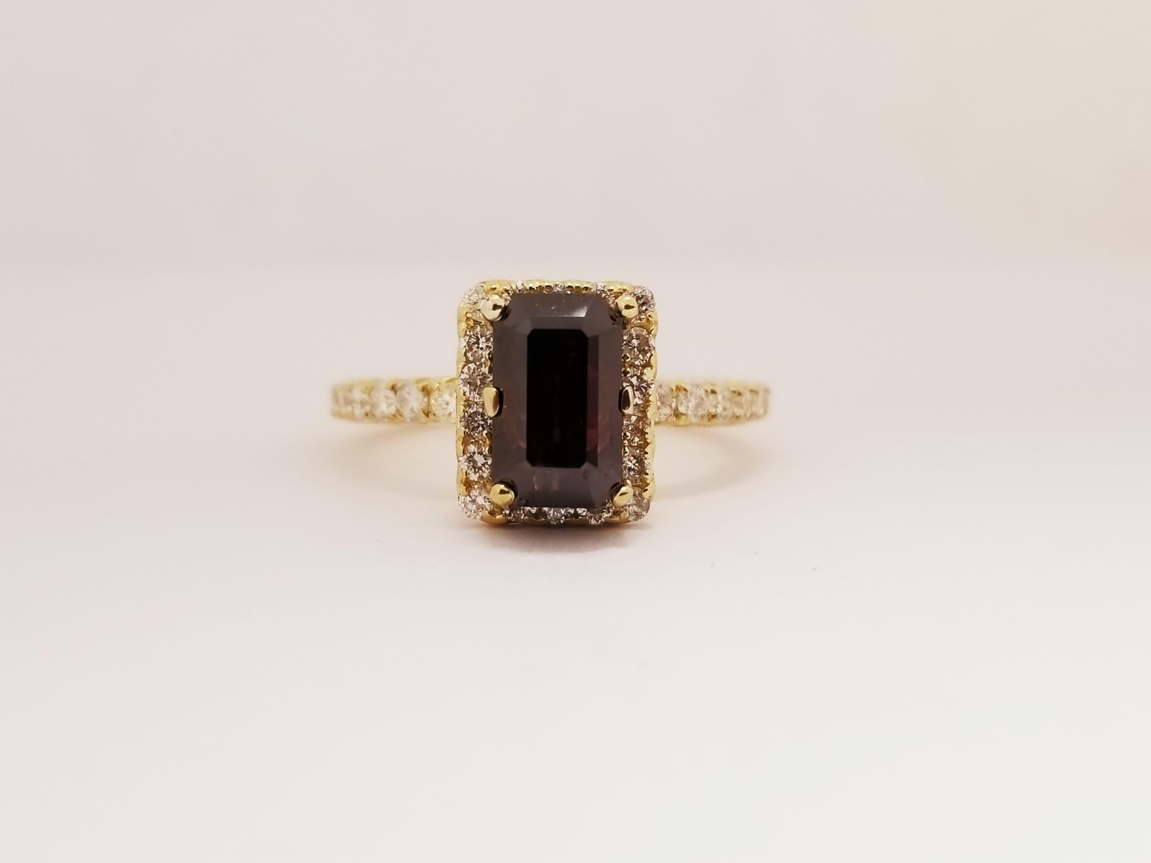 GIA fancy reddish brown emerald cut natural diamond ring weighing 2.36 carats.
Beautiful diamond ring with center stone with GIA that has some red rare color which makes the stone special.