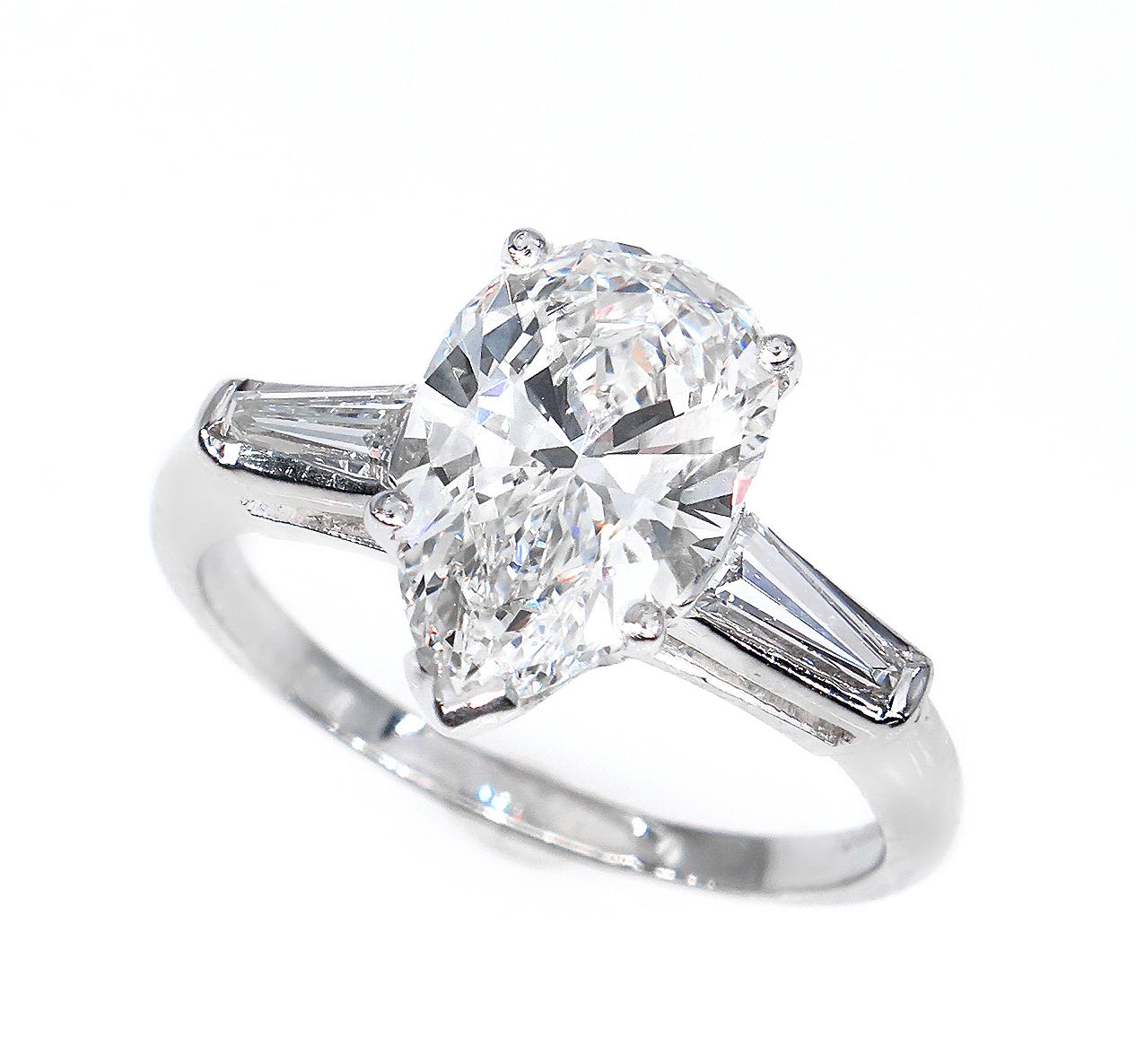 This an exquisite and the most classic, elegant Estate Vintage Pear Shaped Solitaire Ring with over 2ct Center diamond and 2 Large baguettes 2.38ct in total weight .
Great opportunity to own a LARGE 100% NATURAL , NONE-treated Almost FLAWLESS and