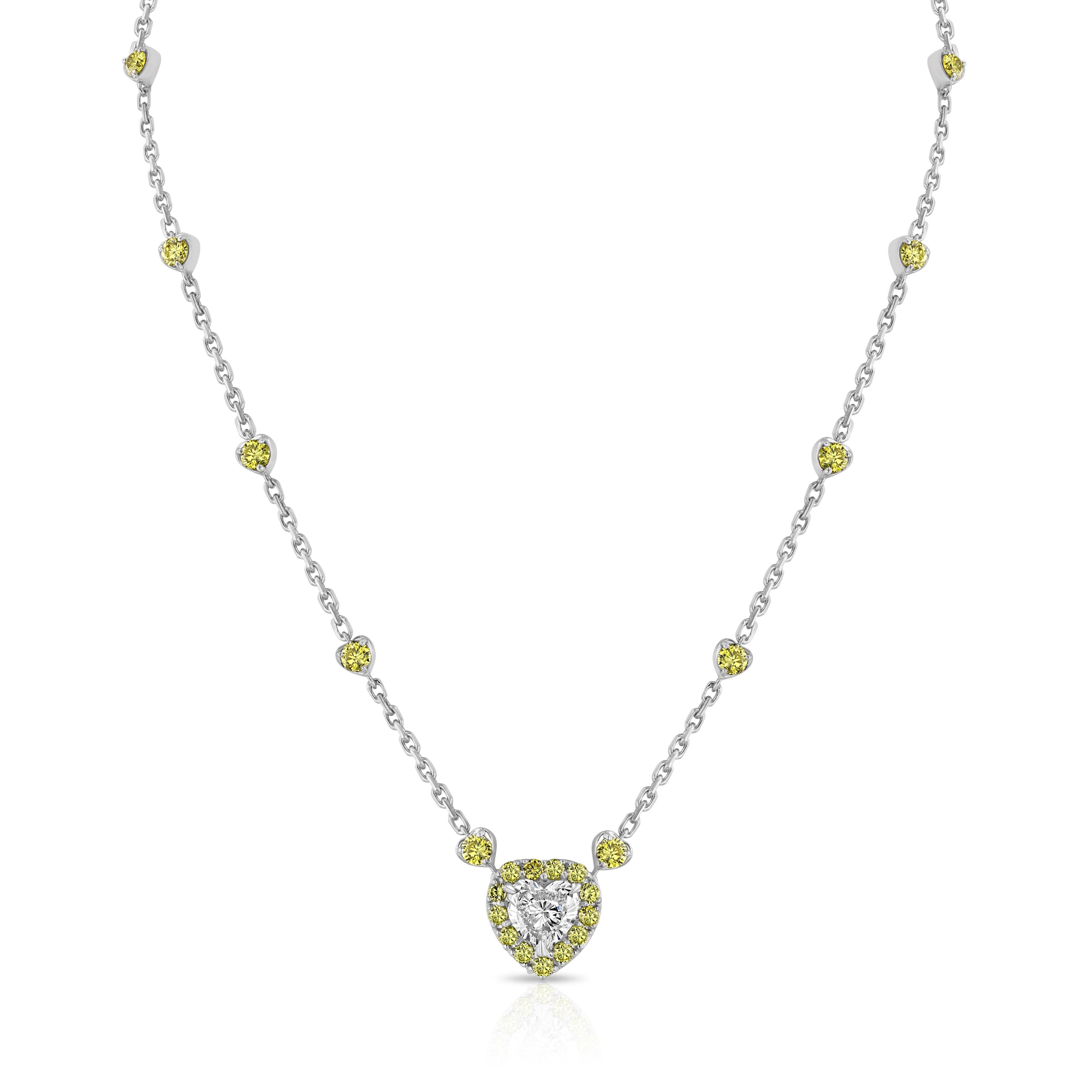 - 2.40 carat heart cut diamond VS2, GIA Certified. F color
- 29 yellow diamonds, totaling 3.05 carat
- 18K White Gold

The heart shaped diamond is set in platinum.