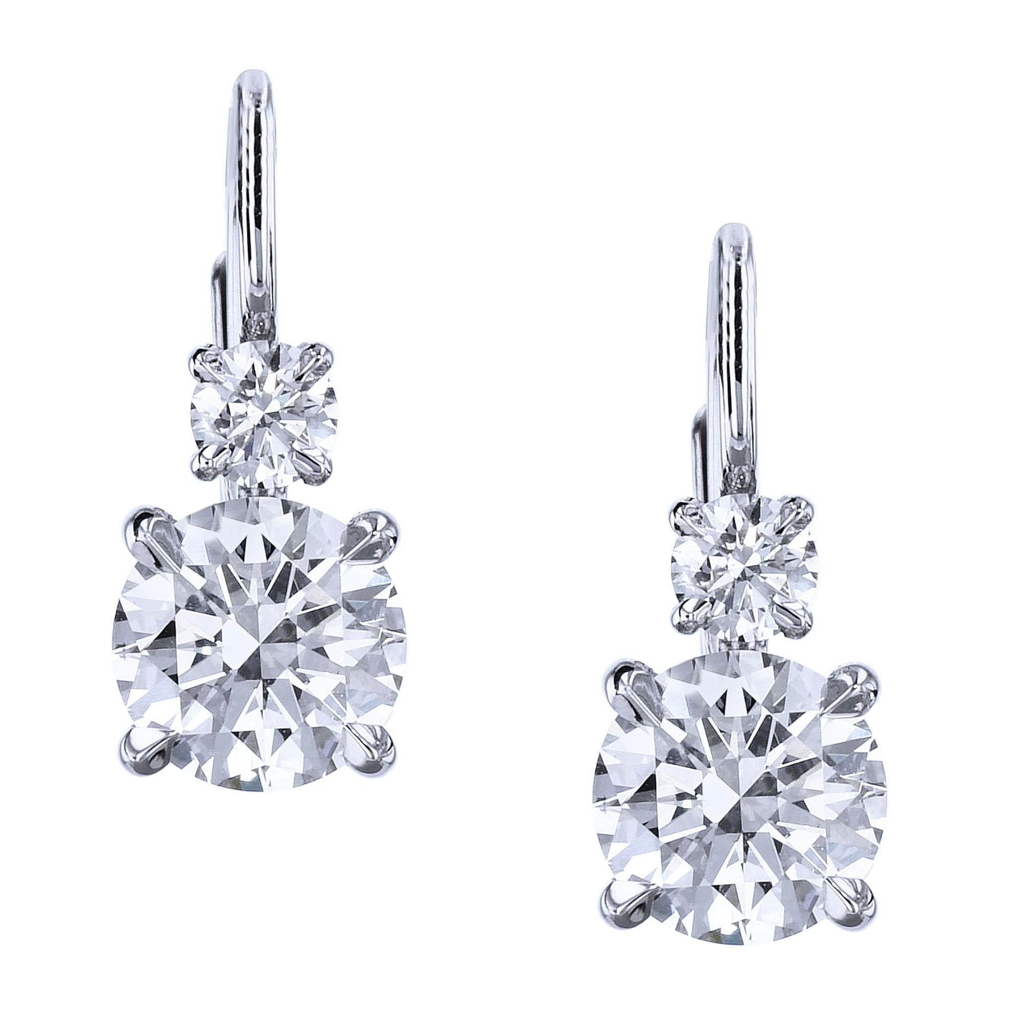 GIA 2.42 Diamond Drop Earrings Lever Back Handmade Earrings

These sparkling earrings are handmade and one of a kind. 
They feature at total of 2.42 carats of white diamonds. 

They are created in 18 karat white gold.

The top diamonds are a total