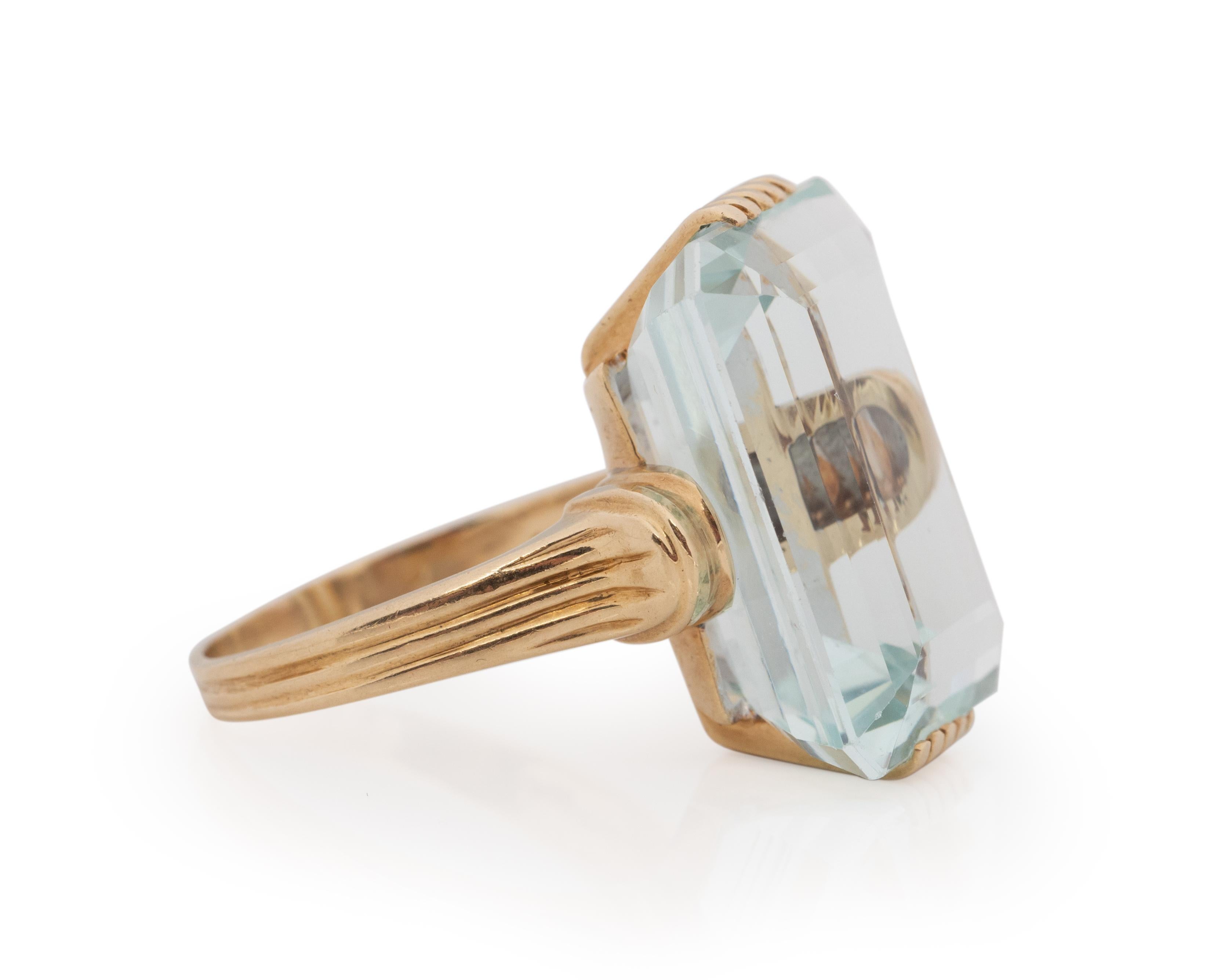 Ring Size: 9
Metal Type: 14K Yellow Gold [Hallmarked, and Tested]
Weight: 12.8 grams

Center Aquamarine Details:
GIA REPORT #:
Weight: 25.00ct
Cut: Emerald Cut
Color: Blue

Finger to Top of Stone Measurement: 15mm
Condition: Excellent