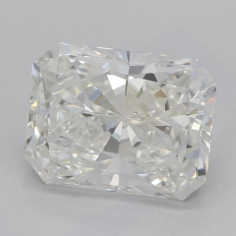 Handcrafted in New York, a stunning diamond ring that exemplifies timeless beauty and sophistication, featuring a captivating radiant center stone weighing 2.50 with a striking H and clarity of SI1. Its classic three-stone design is enhanced by two