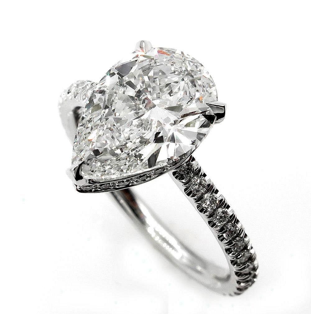 This ring is just breathtaking and SUPER Fine and truly show stopper, 2.50ct in total!
A Beautiful and Elegant Solitaire PEAR Shaped Diamond Ring with 2.02ct GIA CERTIFIED J Color SI1 Clarity (Near-colorless, eye clear), 100% NATURAL. The