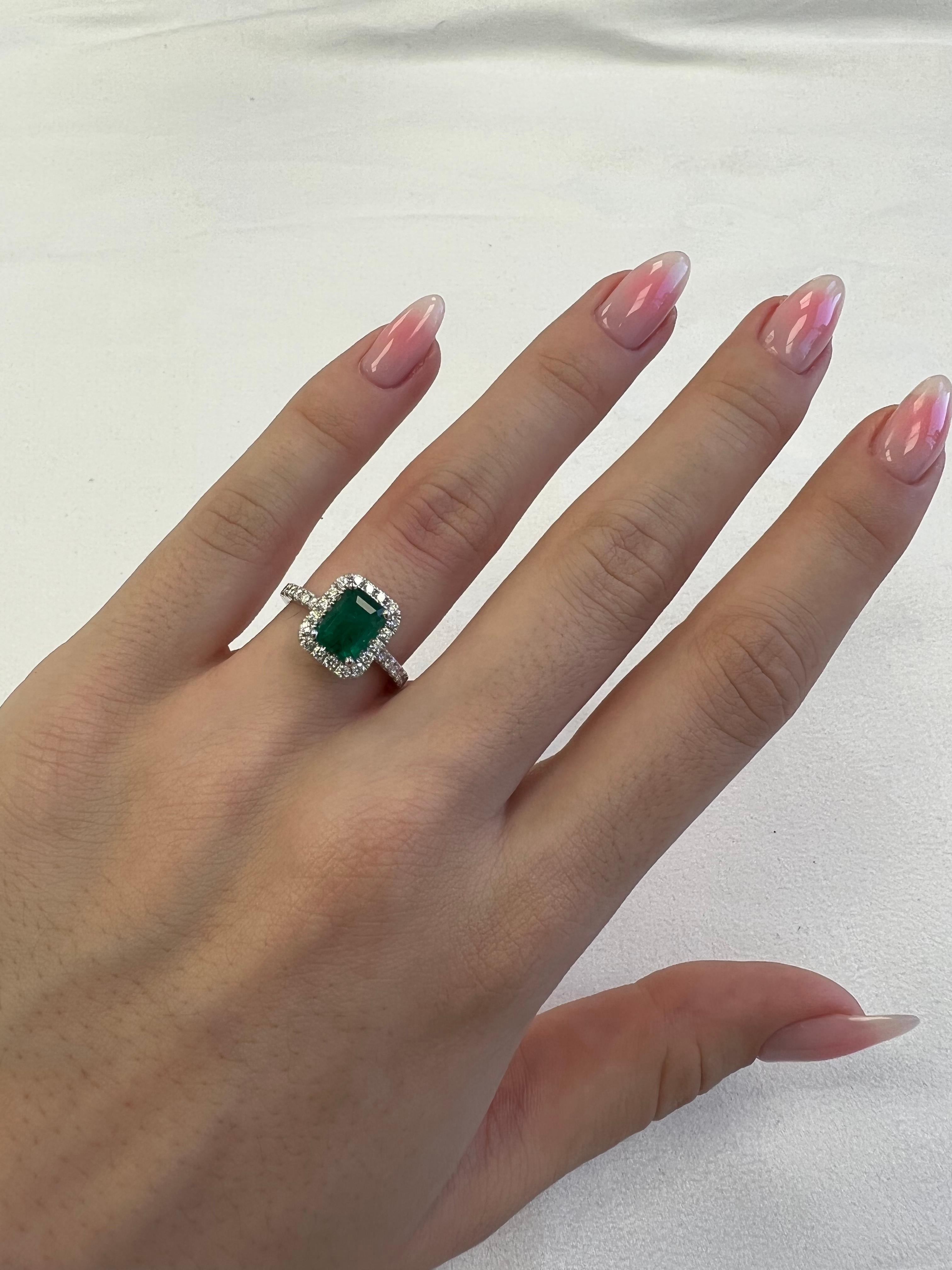 Classic emerald and diamond halo ring, GIA certified. 
2.52 carats total gemstone weight.
1.95 carat emerald cut emerald, F2, GIA certified. Complimented by 40 round brilliant diamonds, 0.57 carats, F/G color and VS clarity. 18k white gold, 4.65