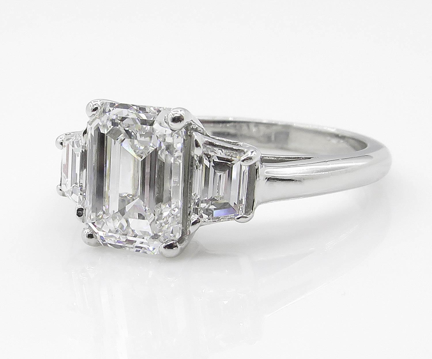 emerald cut 3 stone engagement ring