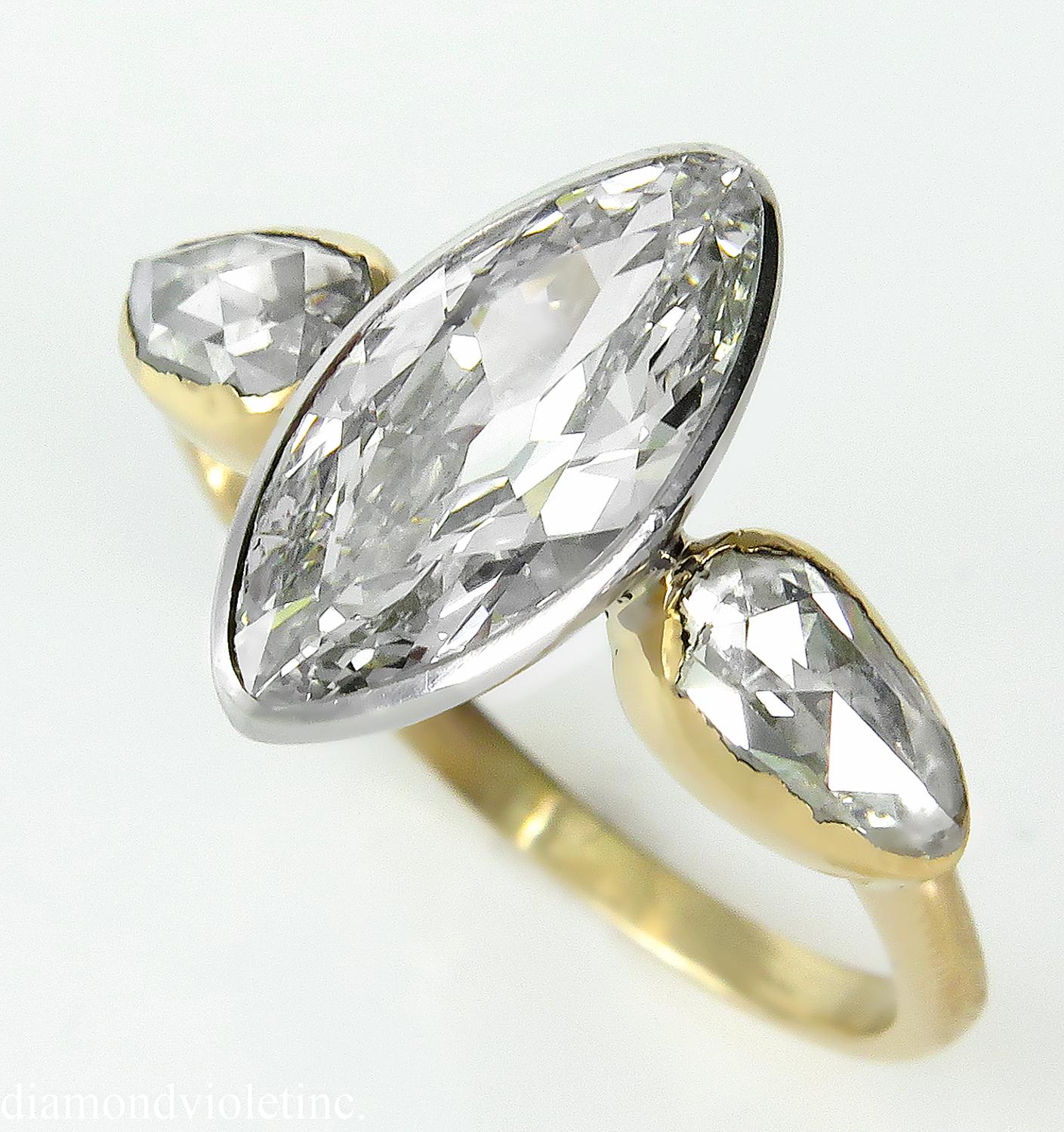 A Timeless Antique Vintage Late XIX Century 3 Stone Engagement Ring in 18k Yellow gold (traces of stamp) with GIA Certified 1.55ct Old Marquise Diamond in I color SI1 clarity (Near Colorless and Eye Clear). Perfectly shaped Old Marquise cut's