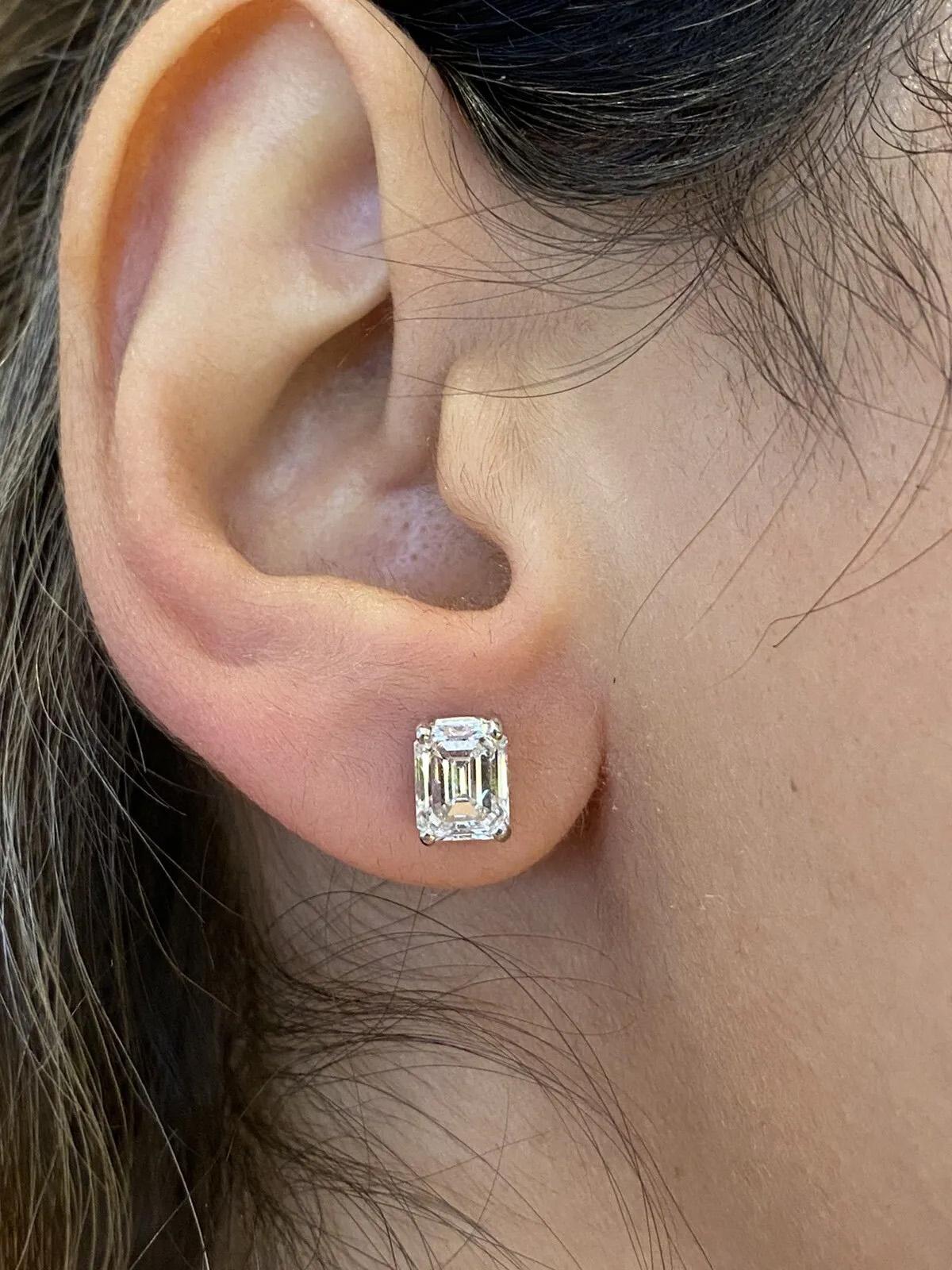 GIA Certified 2.56 carats total Emerald Cut Diamond Solitaire Earrings in 18k White Gold

Emerald Cut Diamond Solitaire Earrings features a pair of GIA Certified Emerald cut Diamond Studs set in 18k White Gold.

The first diamond has a weight of