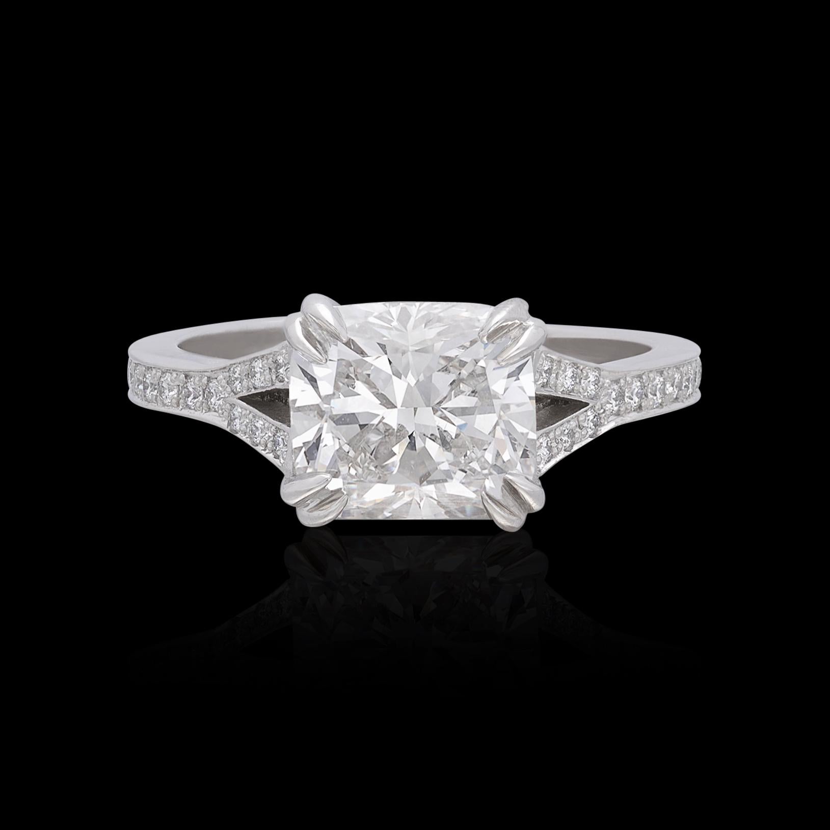 When only the best will do! This extraordinary platinum engagement ring features an eye-catching 2.56 carat Cushion Cut diamond horizontally set in a split shank setting with 32 fine melee diamonds for 0.29 carats. The beautiful center stone has