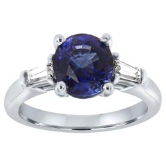GIA 2.65 Carat Oval Blue Sapphire Three-Stone Baguette Diamond Platinum Ring