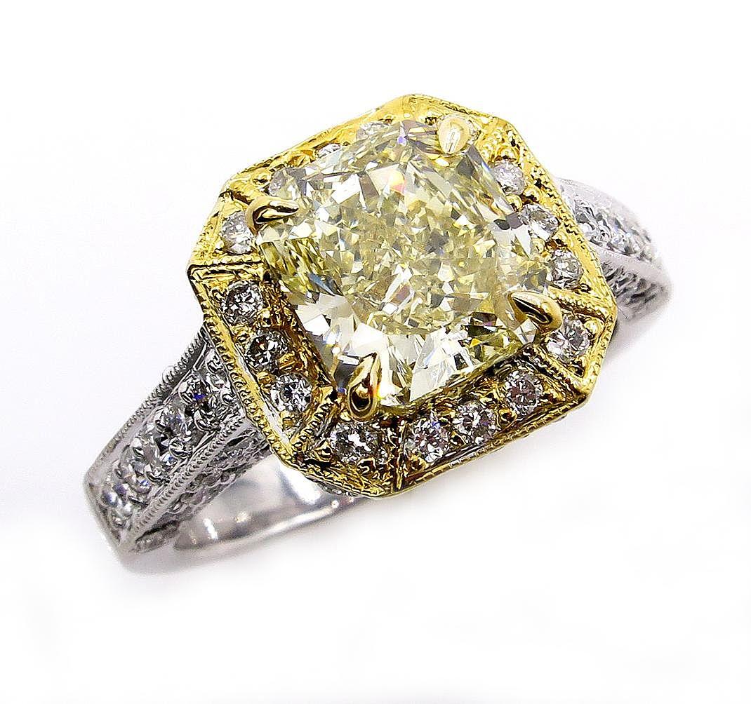 This Sparkling Estate Diamond Ring with almost 3ct in diamonds (2.74ctw) will take your breath away!!
Center Diamond is Radiant 1.91CT GIA Certified as Fancy Brownish Greenish YELLOW color, VS2 clarity. Clear, bright and Brilliant, Nice Saturated