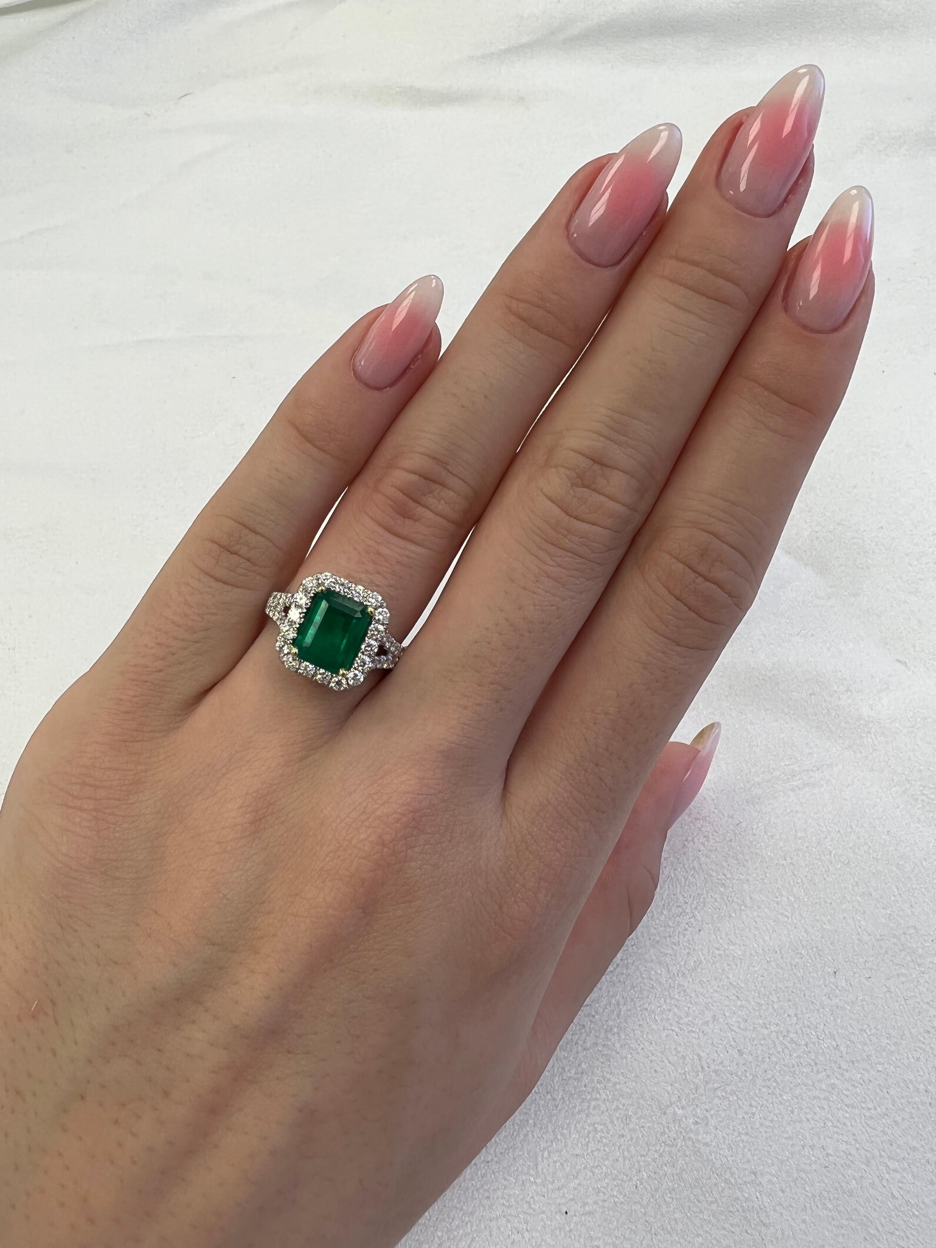 Classic emerald and diamond halo ring, GIA certified. 
2.76 carats total gemstone weight.
1.85 carat emerald cut emerald, F2, GIA certified. Complimented by 50 round brilliant diamonds, 0.91 carats, F/G color and VS clarity. 18k white and yellow