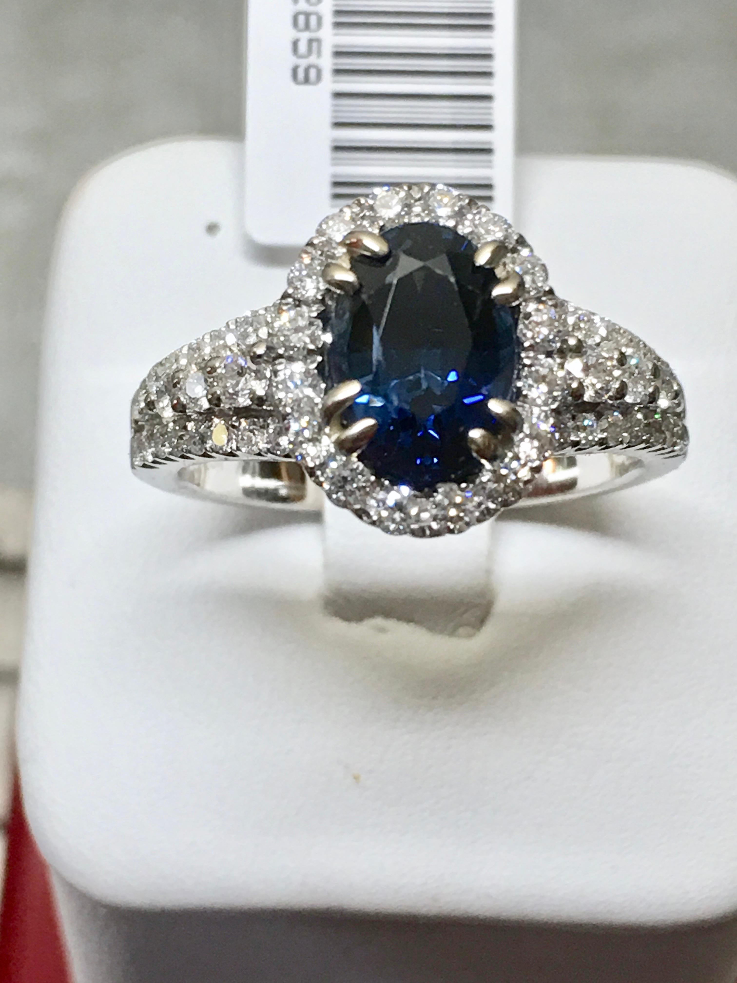 GIA 2.82 Carat Sapphire Diamond Halo Engagement Ring 18K White Gold
Primary Stone: Natural Sapphire GIA Certified
Sapphire Weight: 2.20 Carats 
Shape or Cut Sapphire: Oval Cut
Average Color & Clarity Sapphire: Fine Sapphire Blue /VS
Accent Stones: