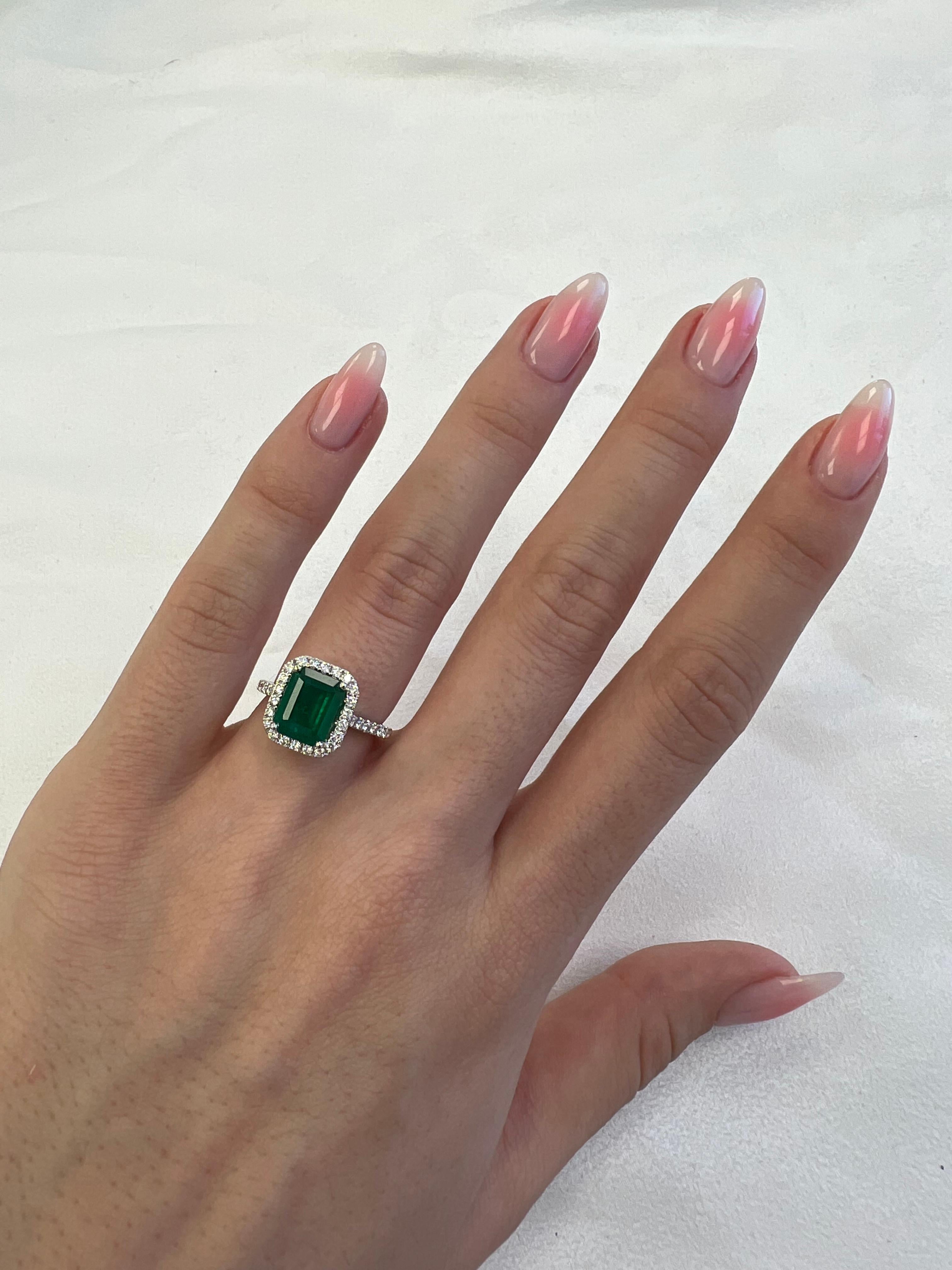 Classic emerald and diamond halo ring, GIA certified. 
2.83 carats total gemstone weight.
2.37 carat emerald cut emerald, F2, GIA certified. Complimented by 38 round brilliant diamonds, 0.46 carats, F/G color and VS clarity. 18k white gold, 4.71