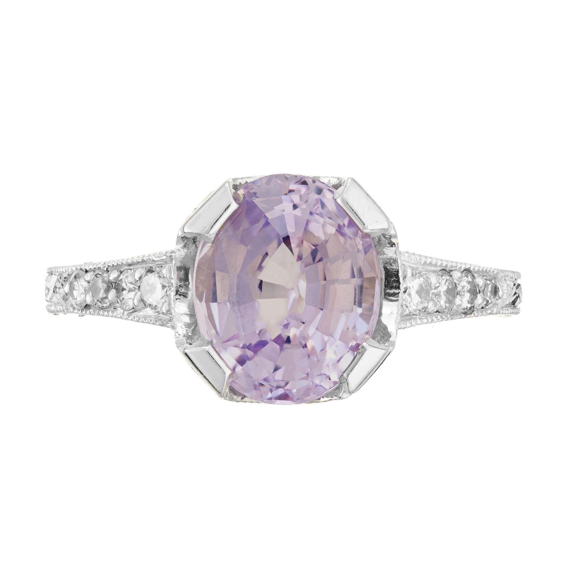 Vintage 1930's Art Deco purple sapphire and diamond engagement ring. GIA certified 2.86ct oval center sapphire in a platinum filigree, engraved setting with 8 round full cut diamonds along both sides of the shank. Certified natural no heat pinkish