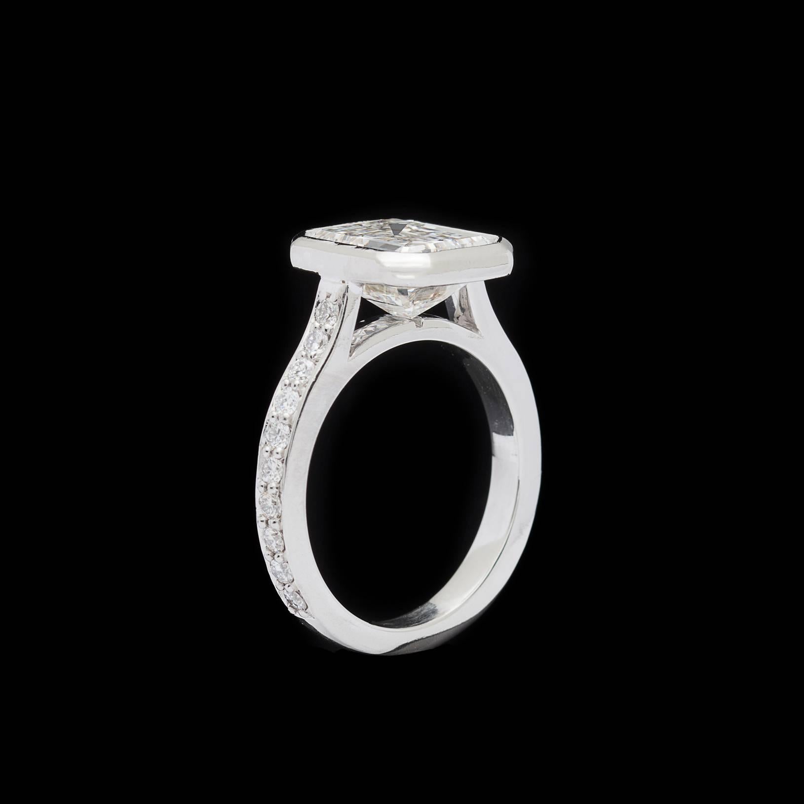bezel set emerald cut diamond ring