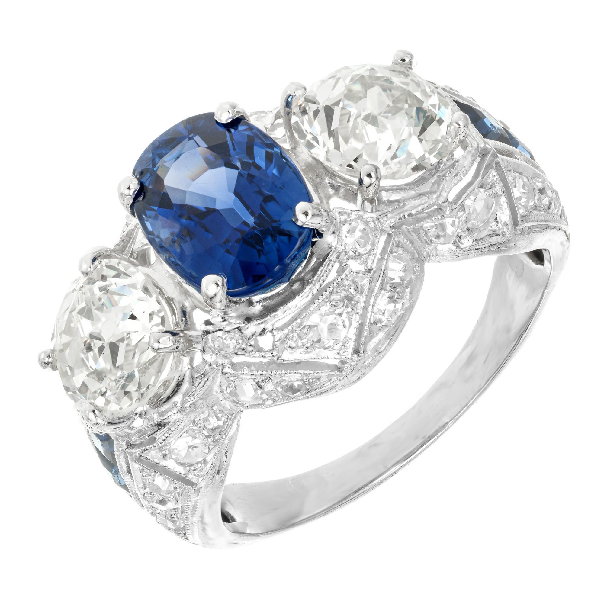 Cornflower Blue Oval Sapphire and diamond engagement ring. GIA certified 2.49cts oval center stone in platinum setting with 2 old mine cut side diamonds and accented with 36 round diamonds and 4 calibre cut sapphires. Natural no heat cornflower