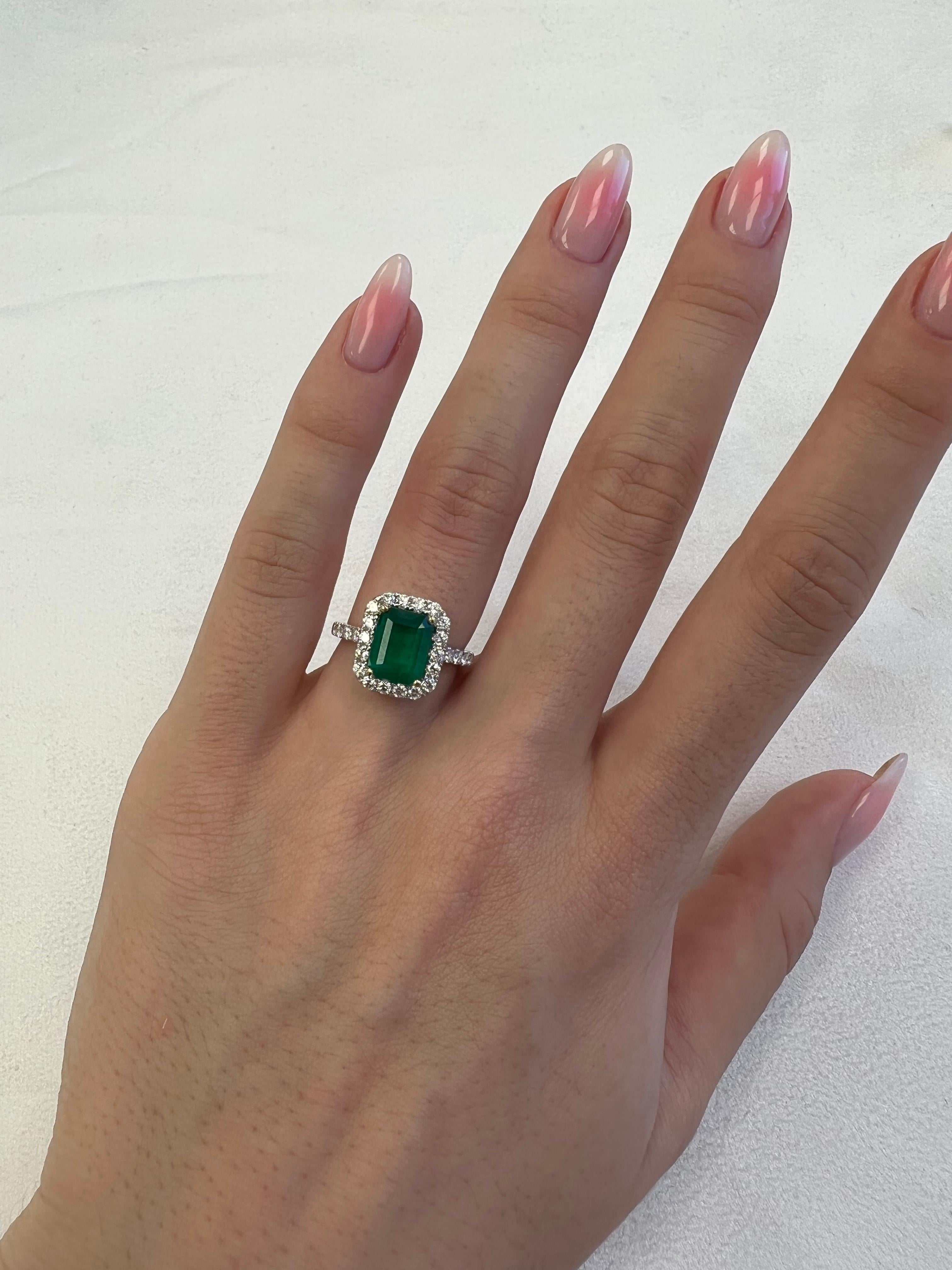 Classic emerald and diamond halo ring, GIA certified. 
2.94 carats total gemstone weight.
2.14 carat emerald cut emerald, F2, GIA certified. Complimented by 30 round brilliant diamonds, 0.80 carats, F/G color and VS clarity. 18k white and yellow