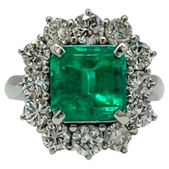GIA 3 Carat Emerald Emerald Cut and White Diamond Ring in Platinum