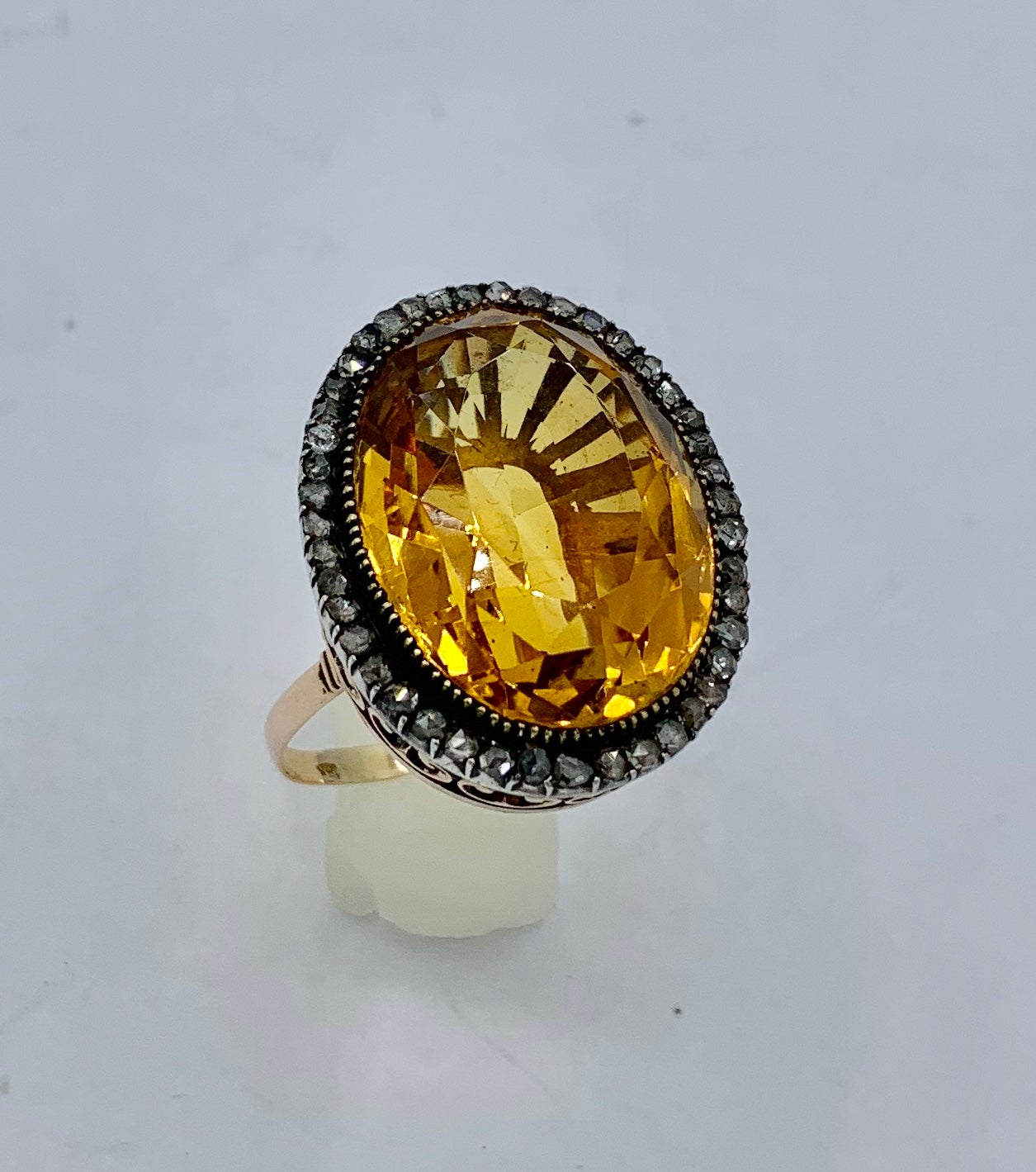 This is an absolutely magnificent antique Belle Epoque 30 Carat Citrine Ring with a halo of sparkling Rose Cut Diamonds in a 14 Karat Rose Gold setting of great beauty.  The magnificent statement ring is one of the finest early antique rings we have