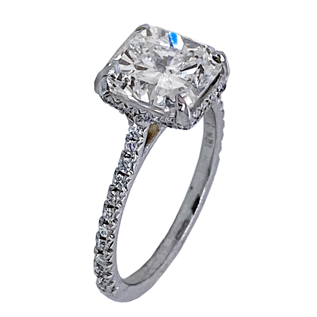 A very fine Square Radiant F/SI1 GIA certified Diamond set in a fine 18k gold French-Pave set Engagement Ring with side halo. Total diamond weight of 0.25 Ct. on the side. 

Diamond specs:
Center stone: 3.00 Ct GIA Certified F/SI1 Radiant natural